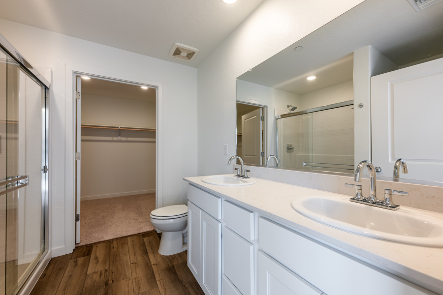 A bathroom with a sink toilet and shower.
