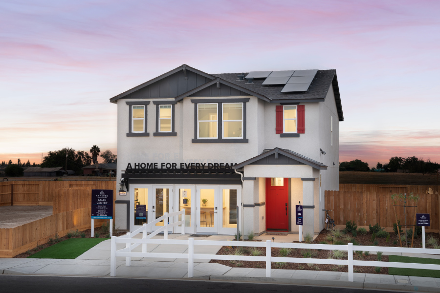 A house with a white picket fence.