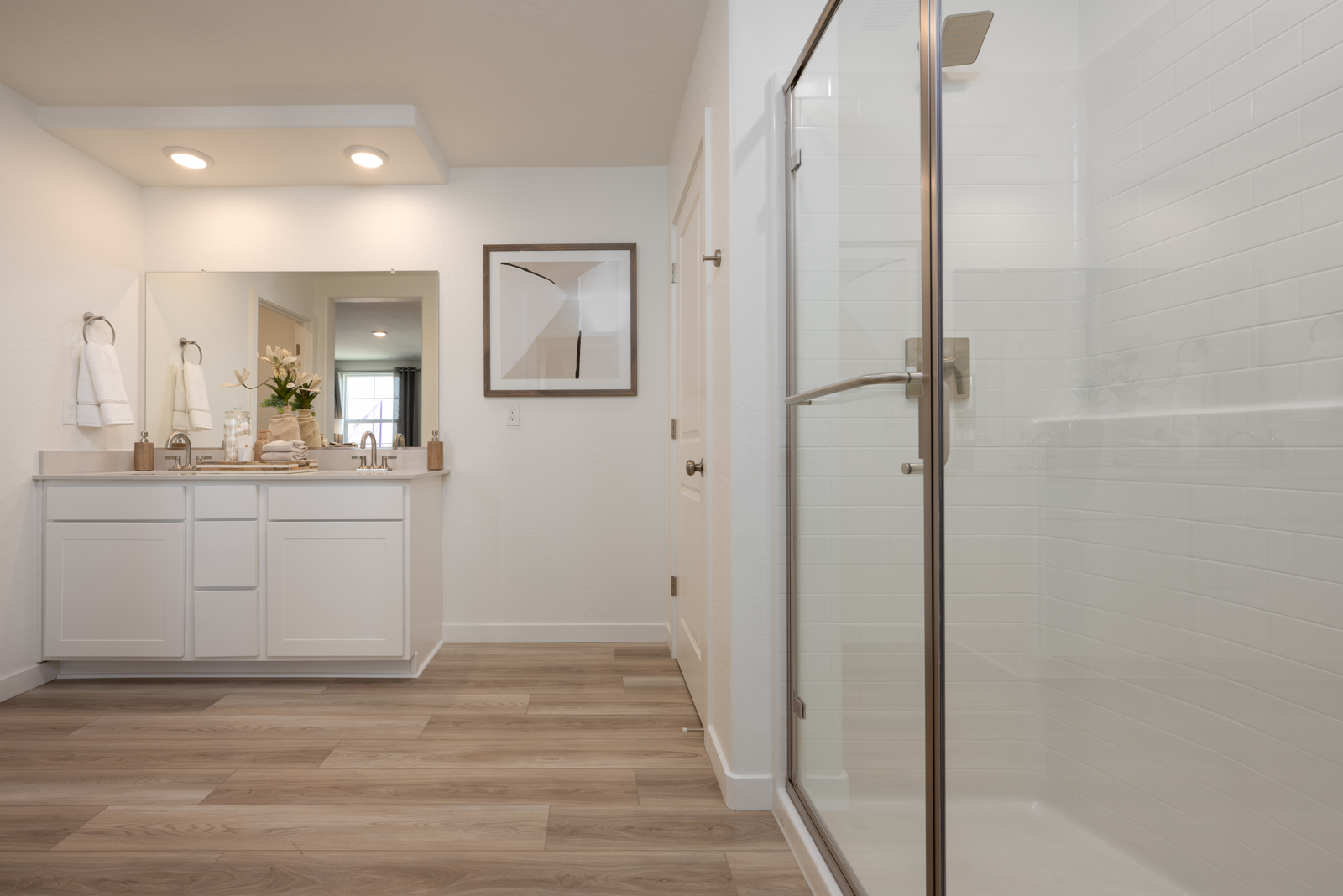 A bathroom with a glass shower.
