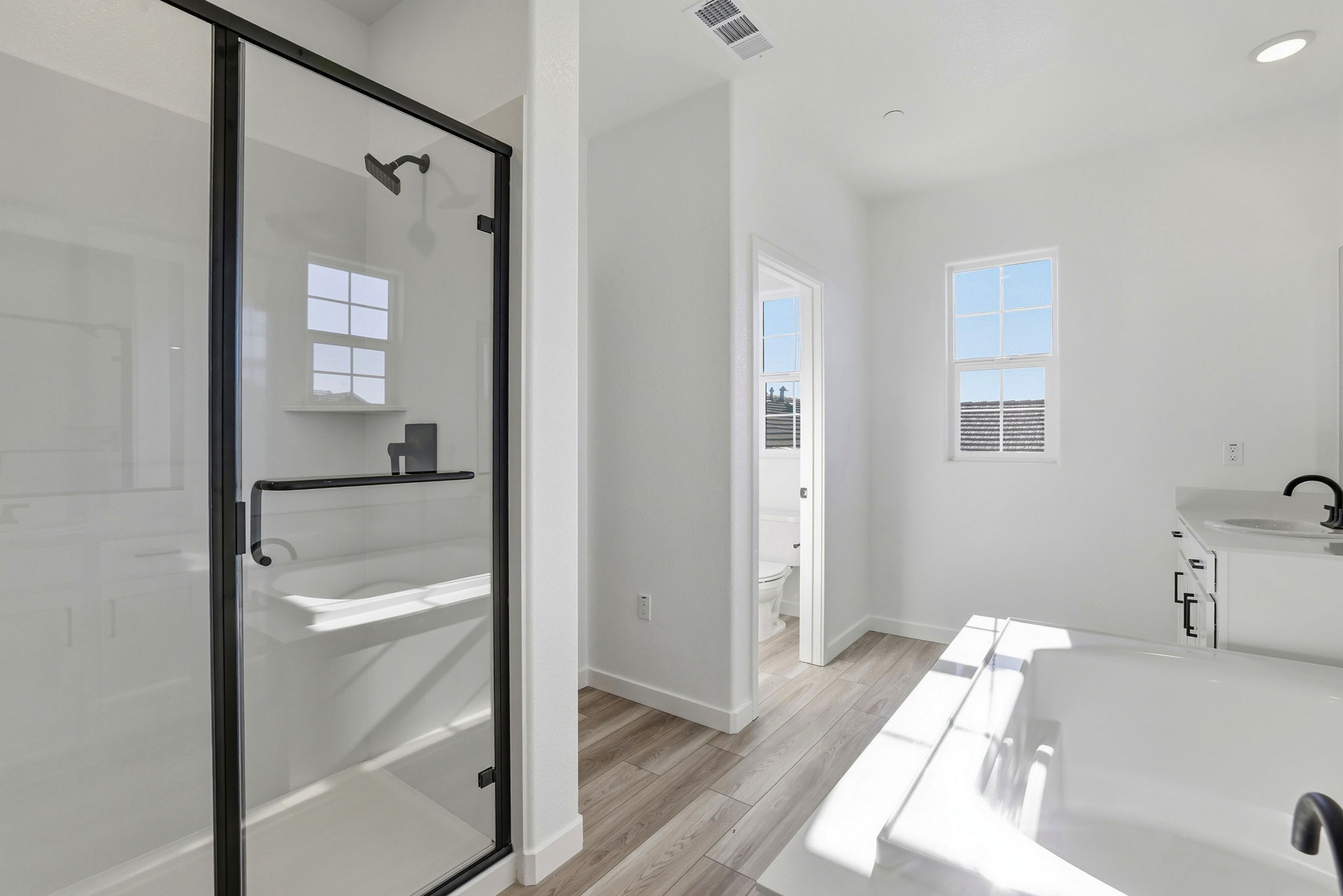 A bathroom with a glass shower.