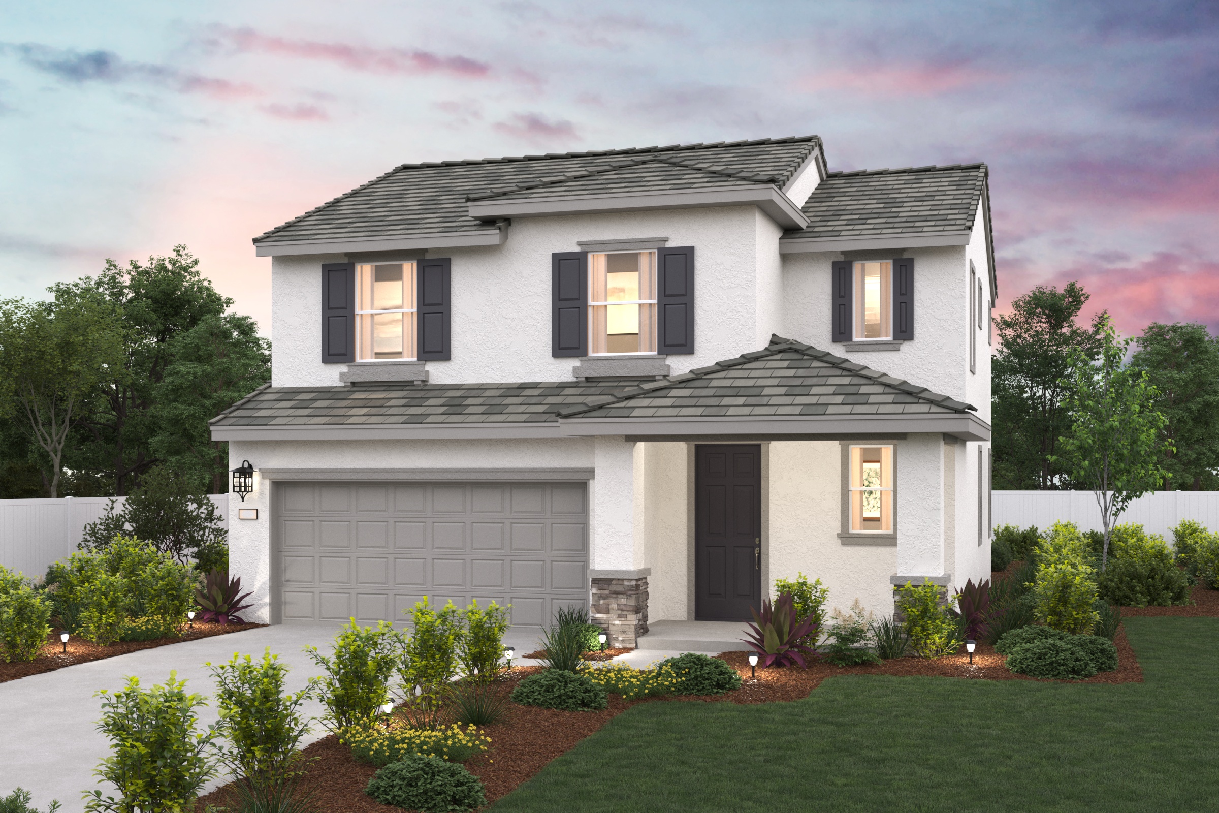 A white house with a green lawn.