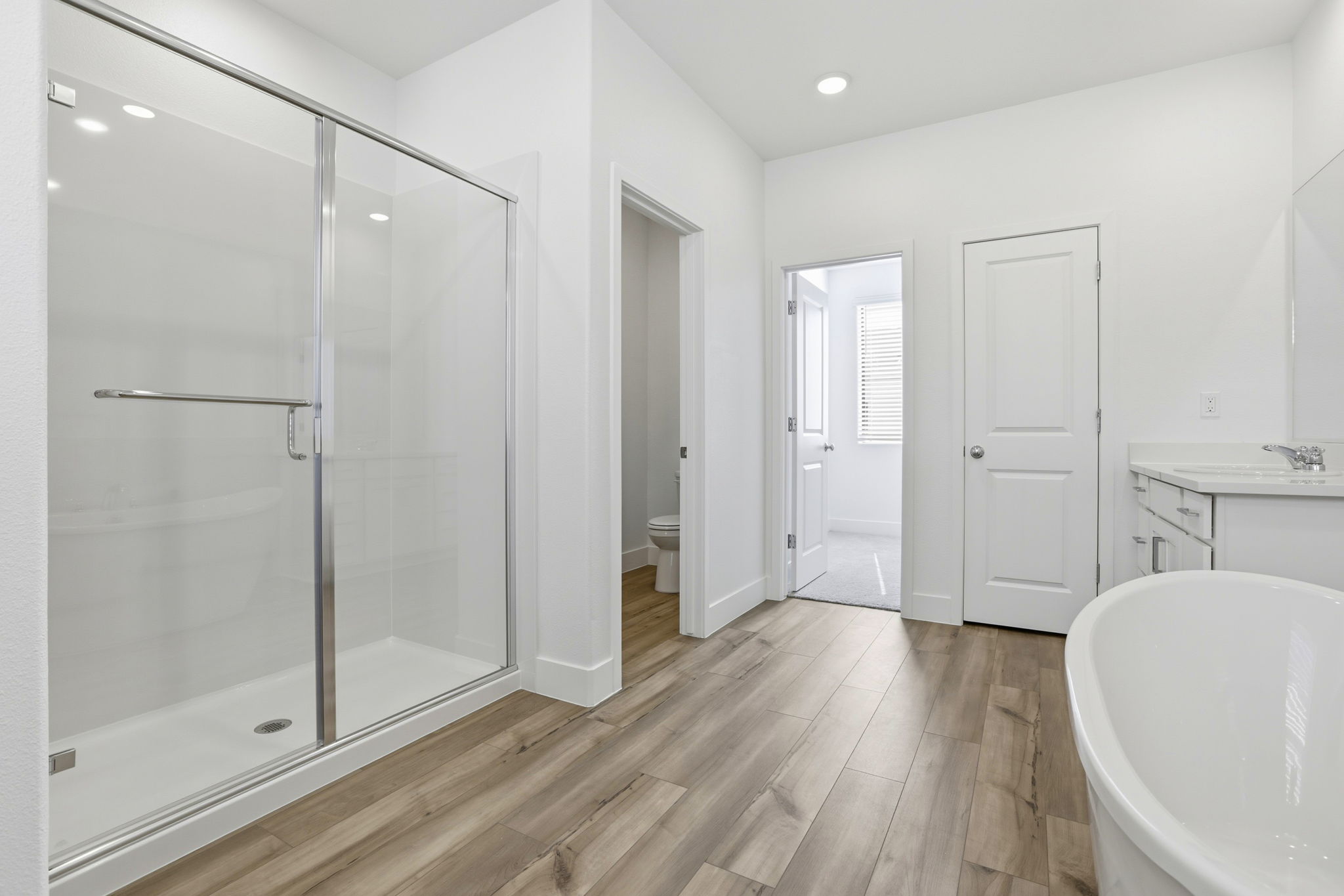 A bathroom with a glass shower.