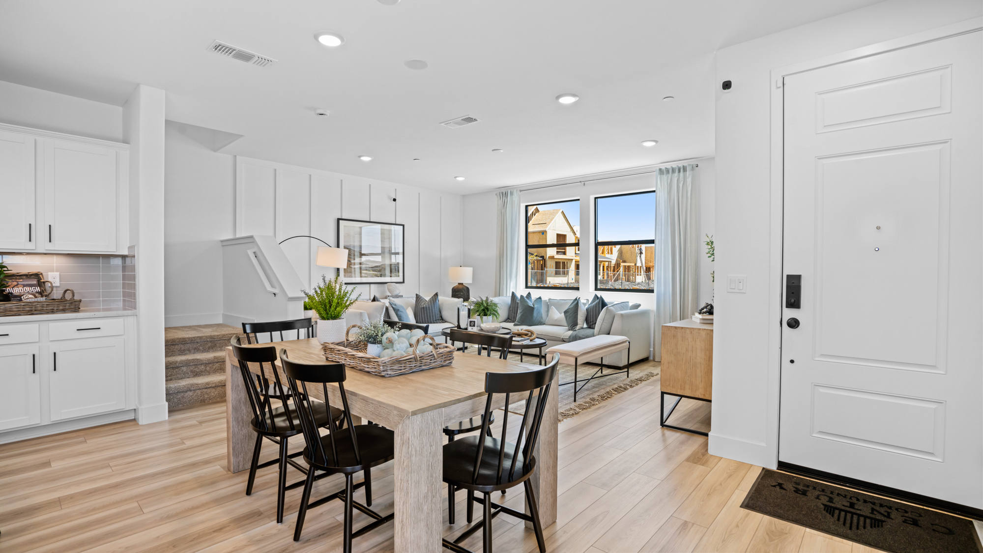 A large kitchen with a dining table.