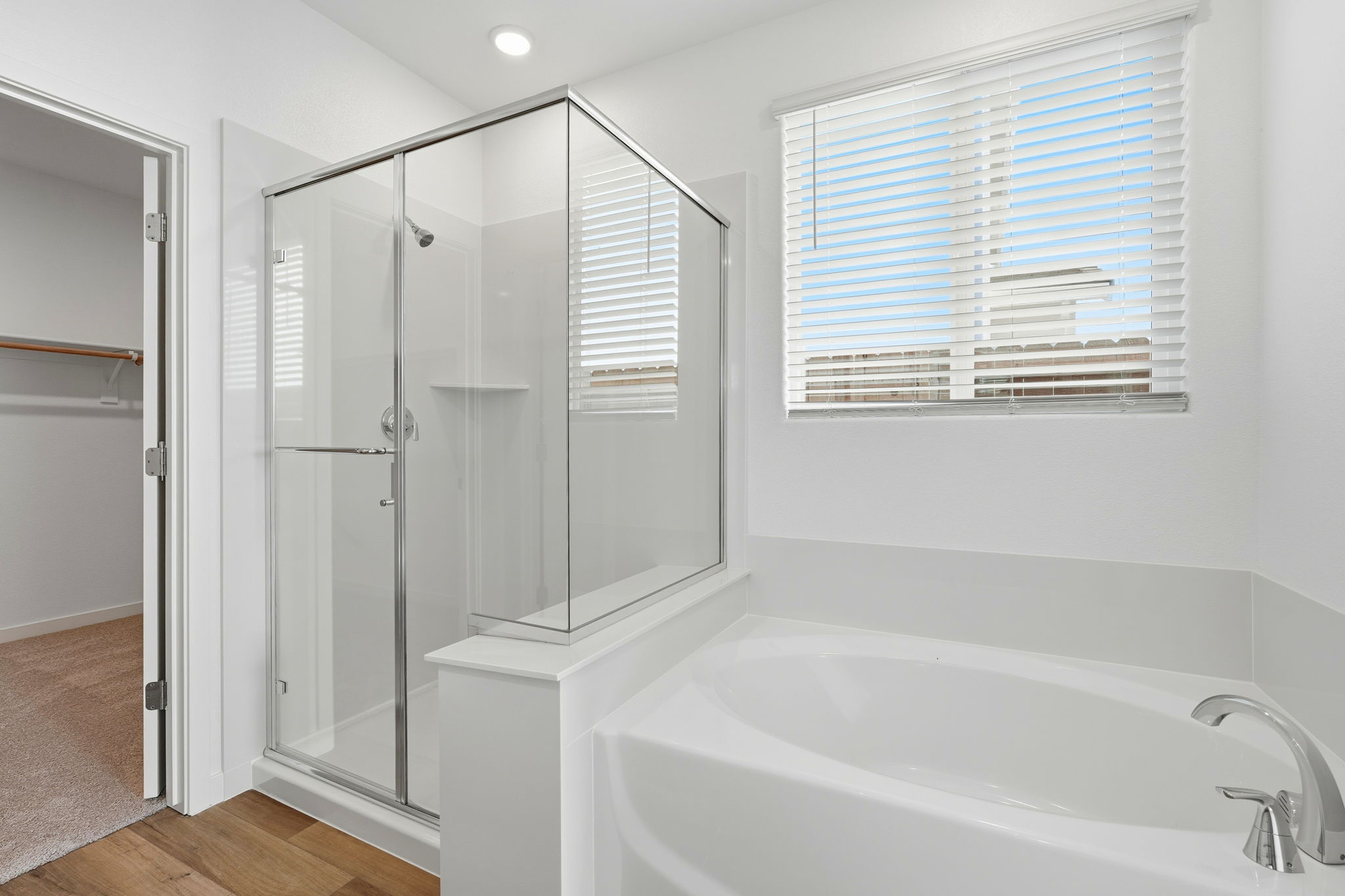 A bathroom with a tub and shower.