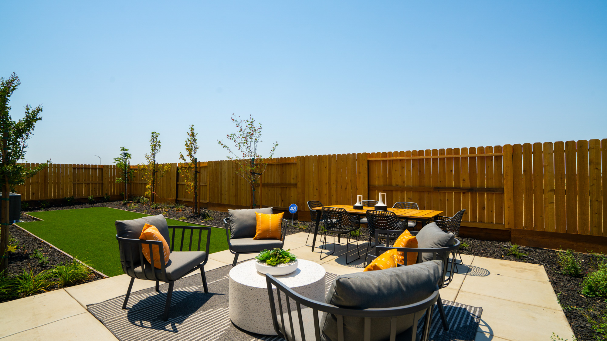 A patio with a table and chairs.