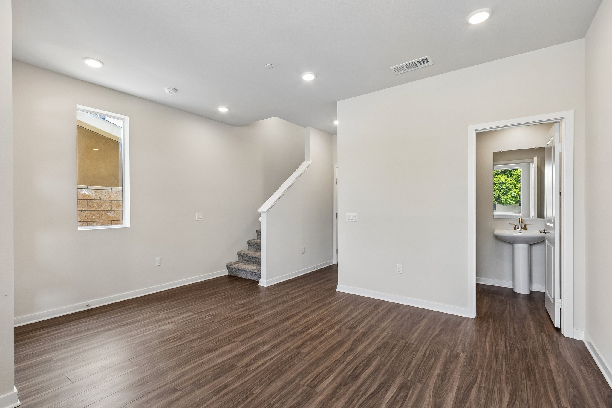A bathroom with a wood floor.