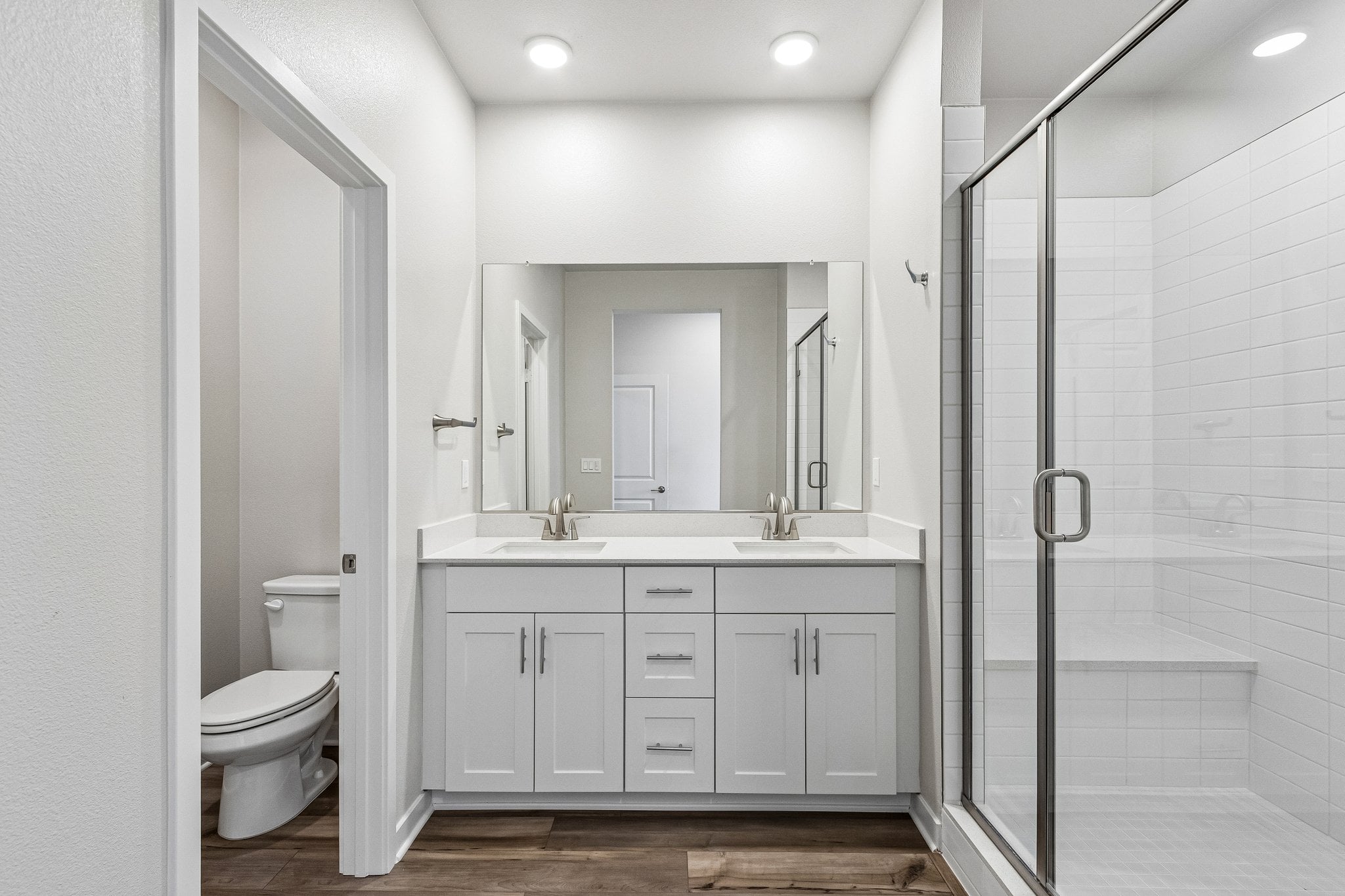 A bathroom with a glass shower.