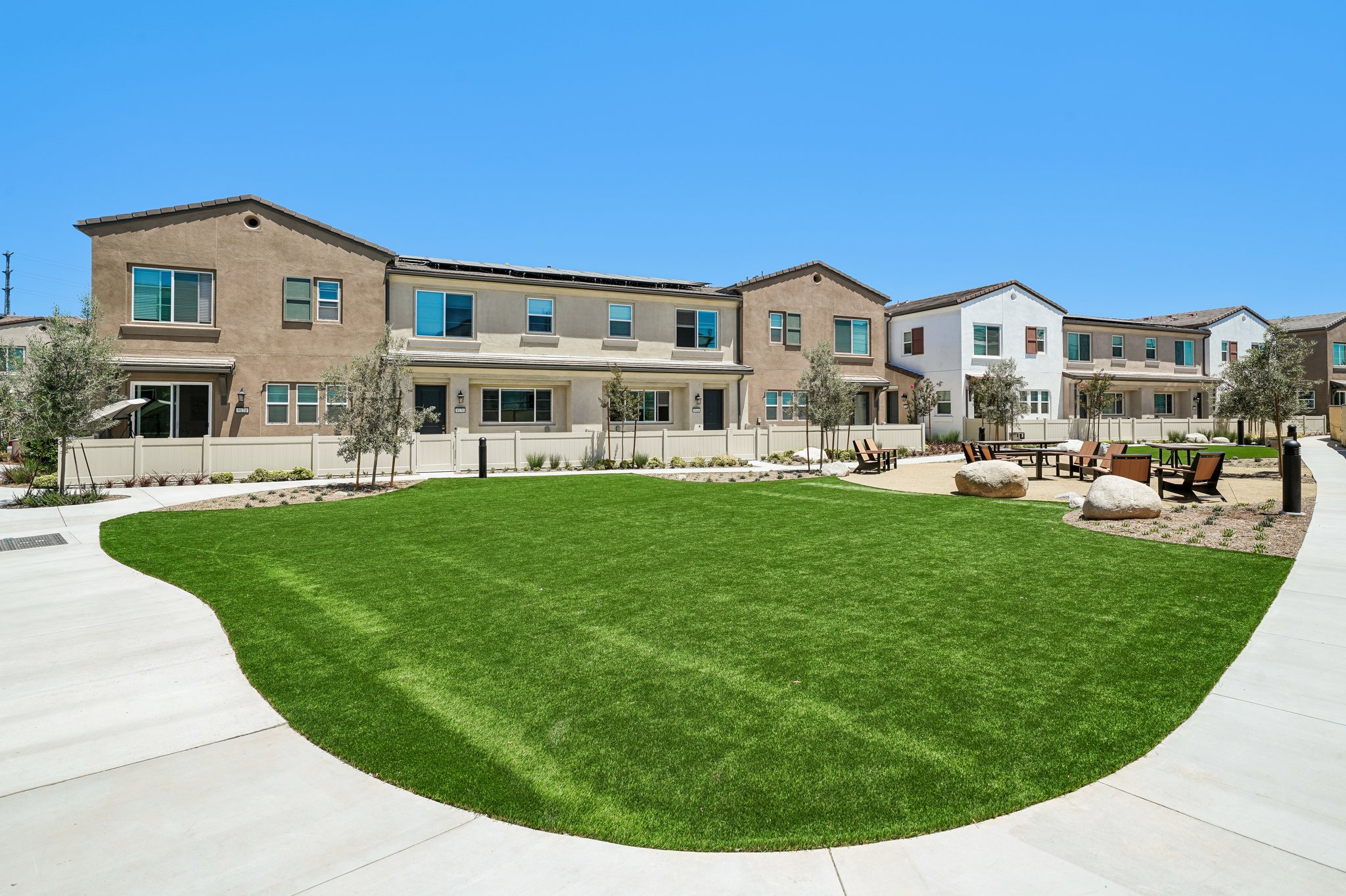 A large building with a lawn in front of it.