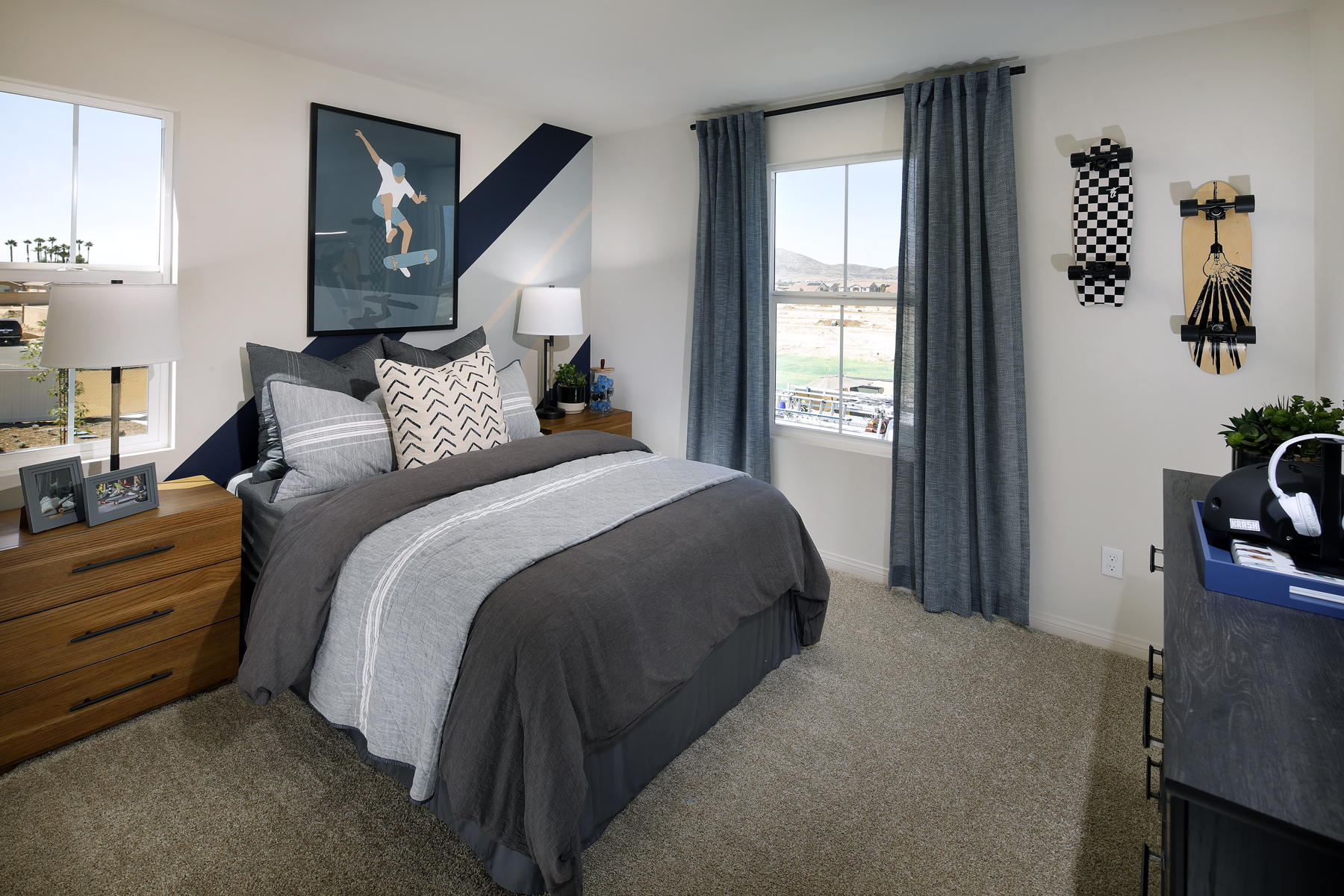 A bedroom with a large window.