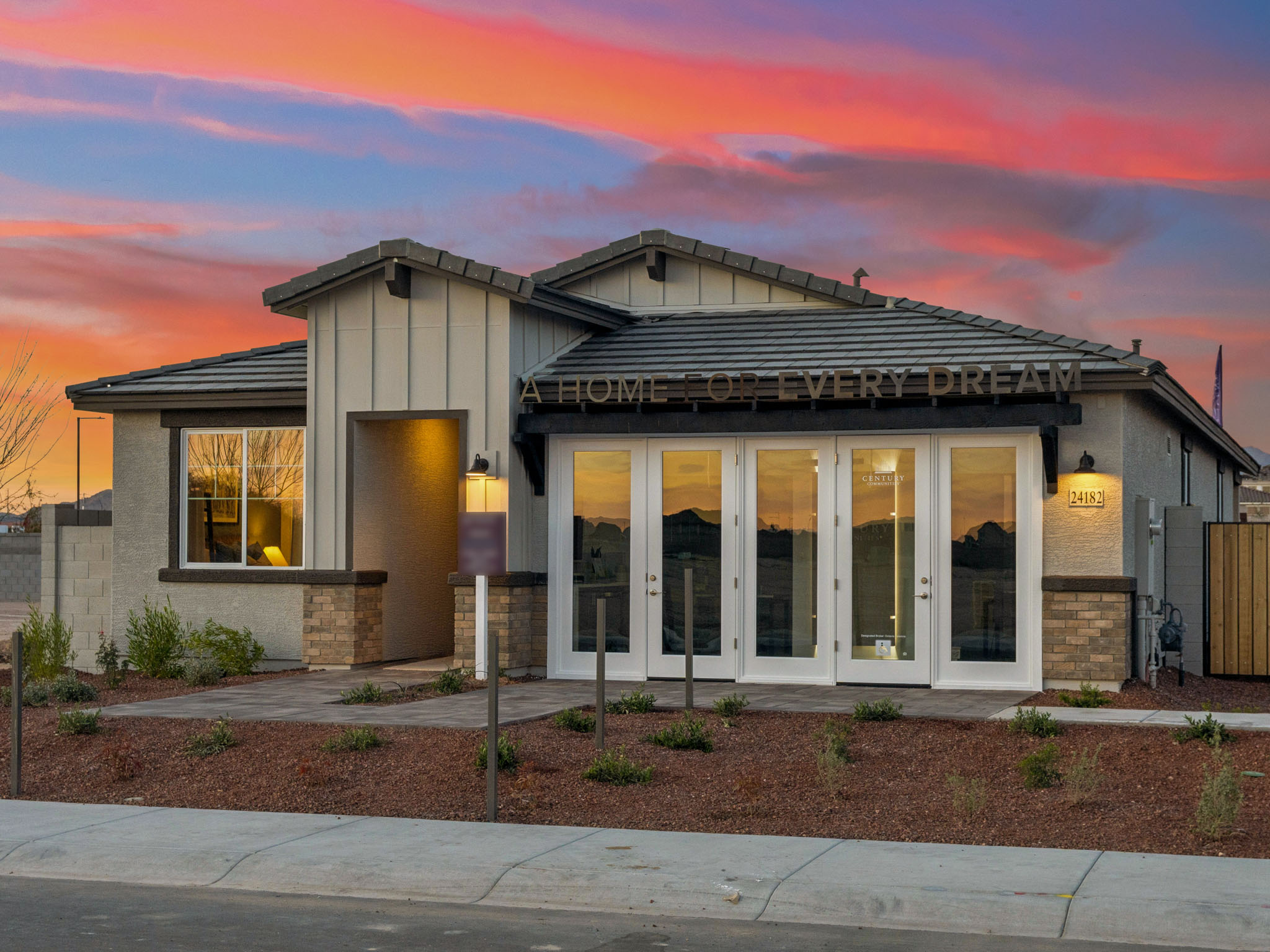 A house with a sunset in the background.