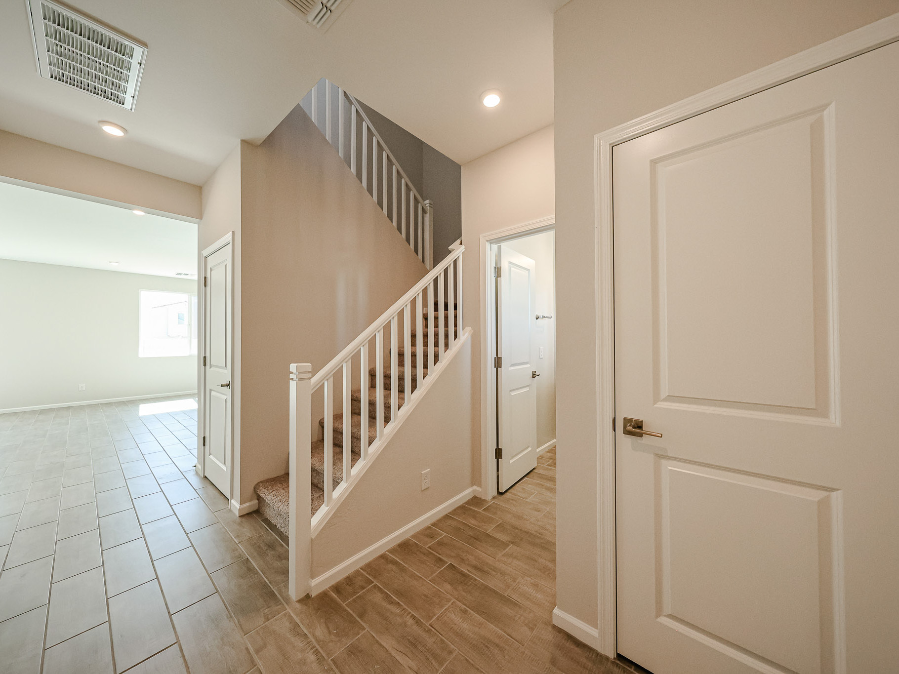 A hallway with white doors.