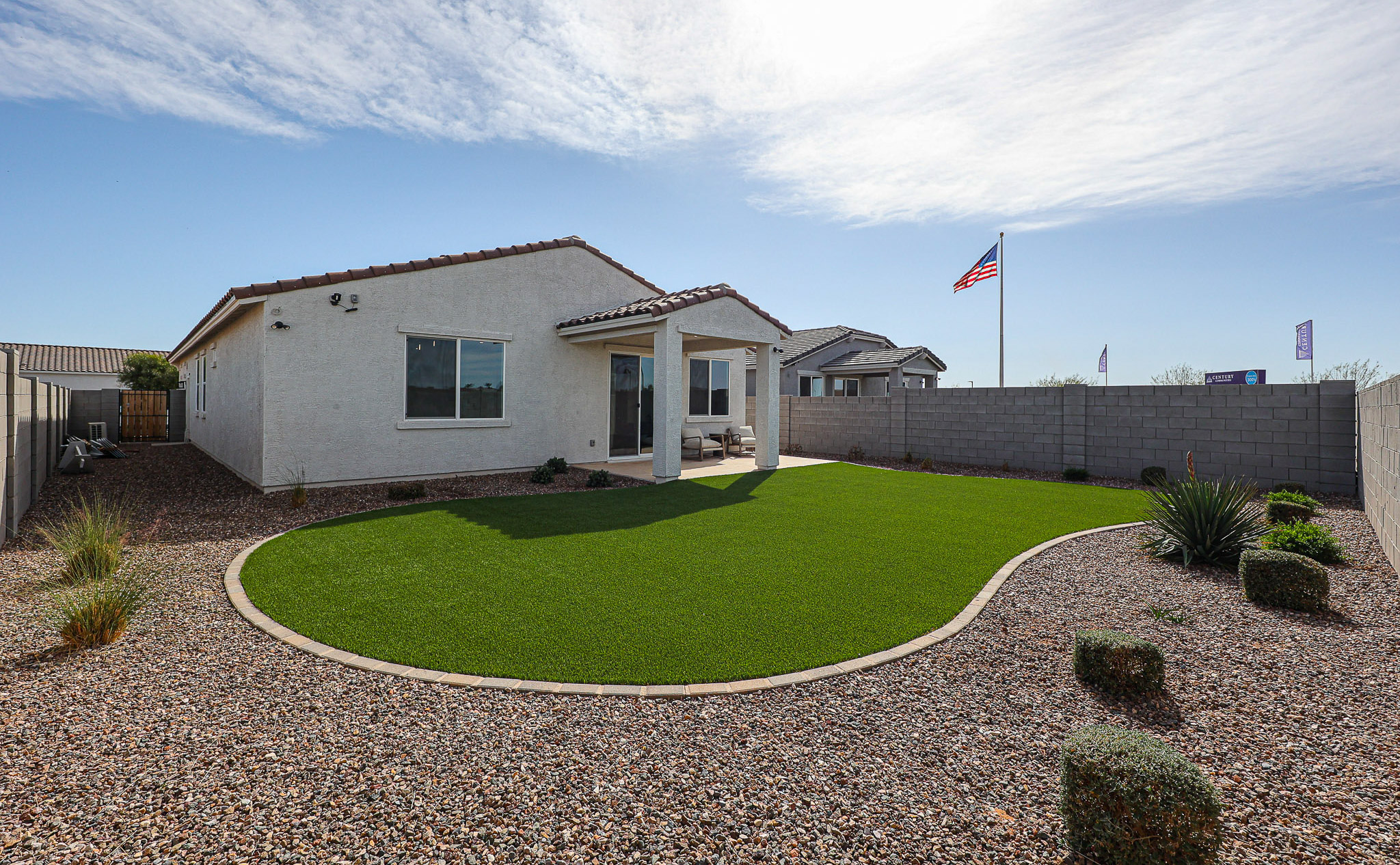 A house with a large lawn.