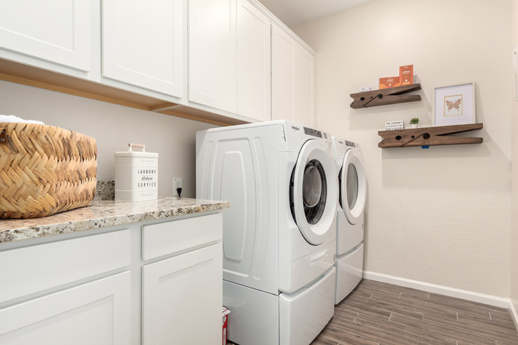 A washing machine in a kitchen.