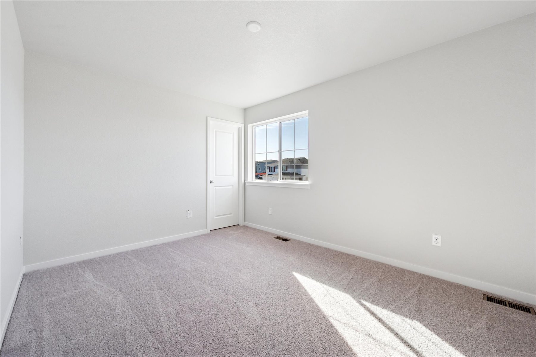 A room with a door and a window.