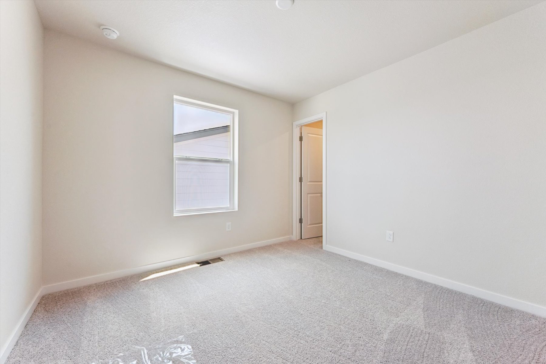 A room with a door and a window.