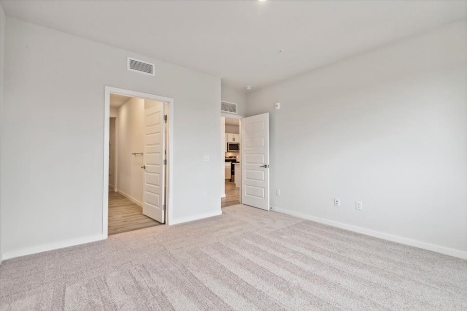 A hallway with white walls.