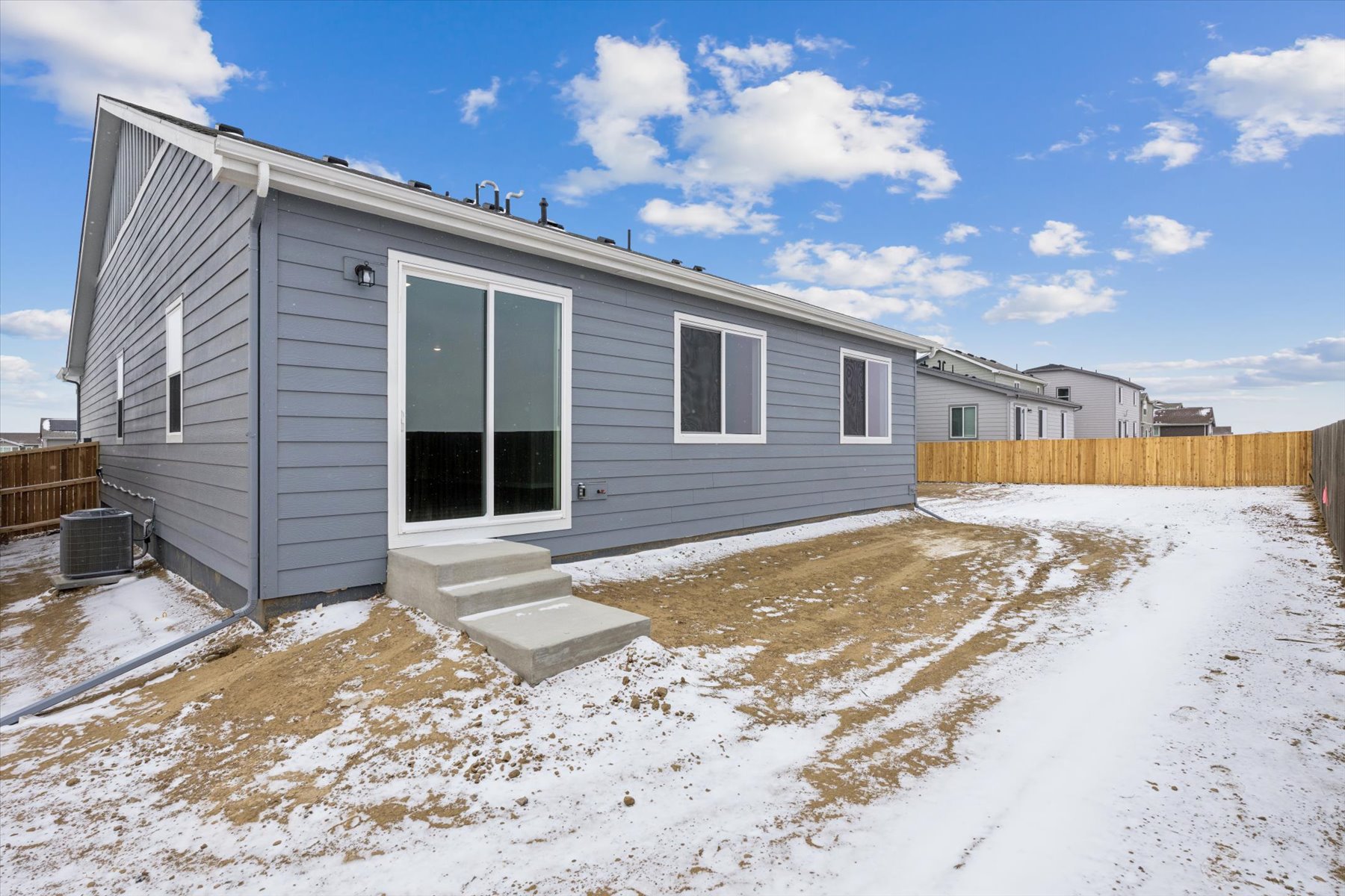 A house with a garage and snow.