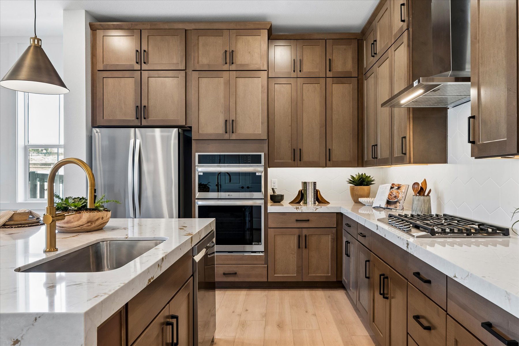 A kitchen with wooden cabinets.
