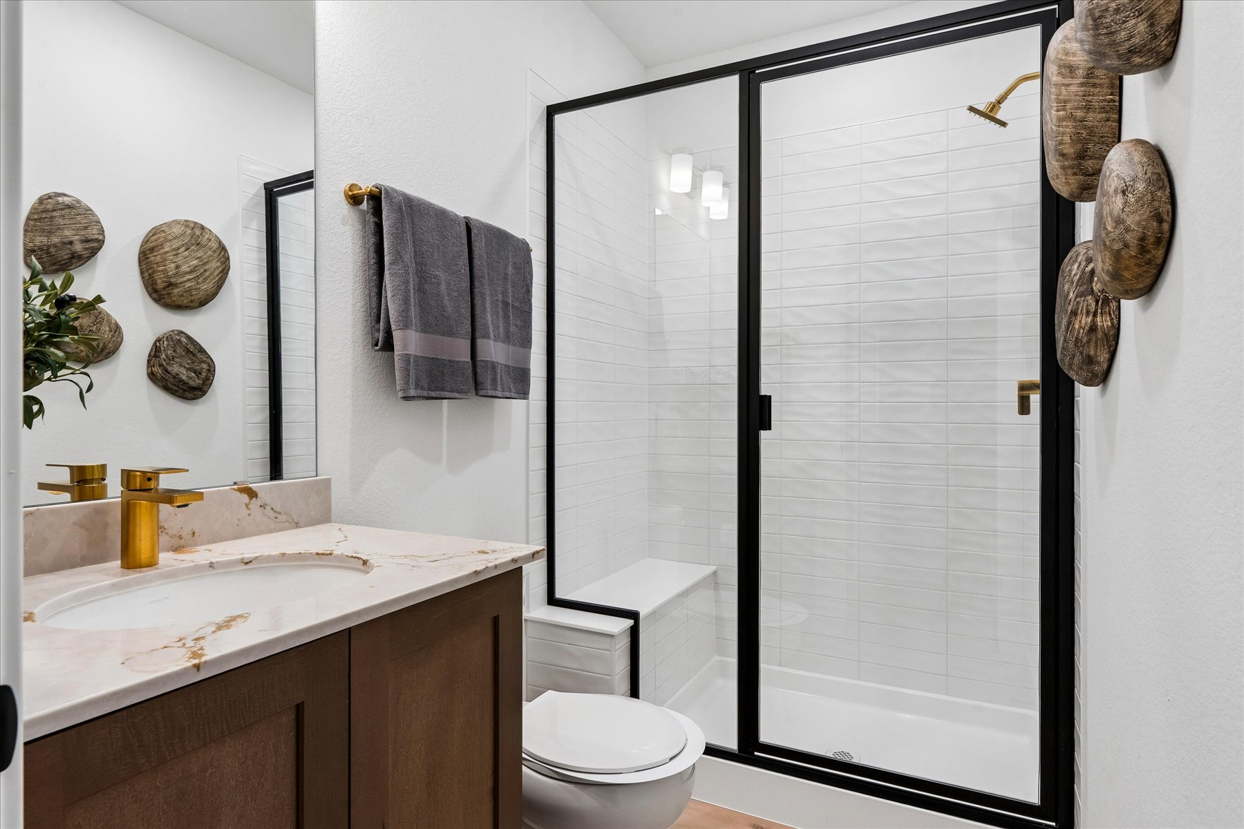 A bathroom with a glass shower.