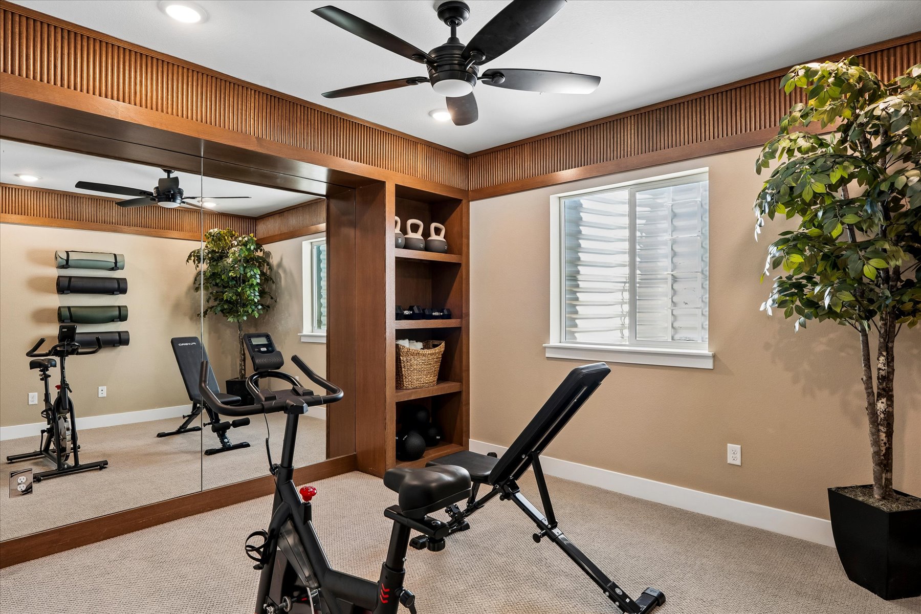 A room with a few exercise equipment.