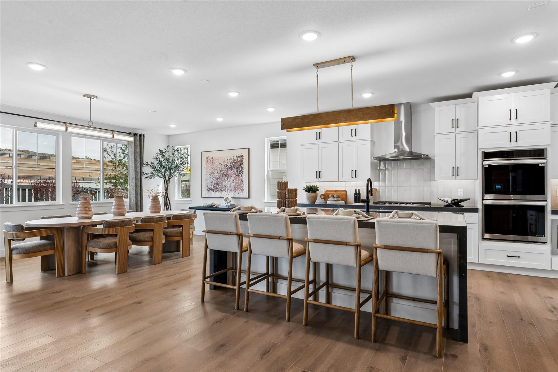 A kitchen with a wood floor.