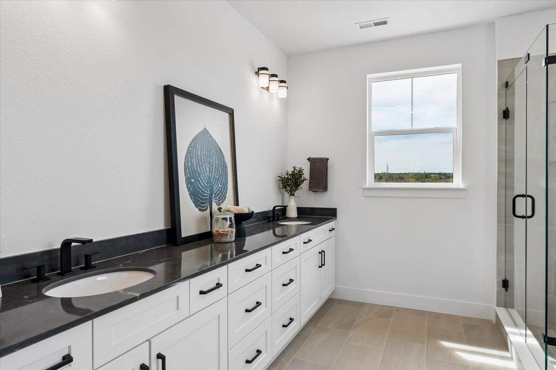 A bathroom with a large mirror.