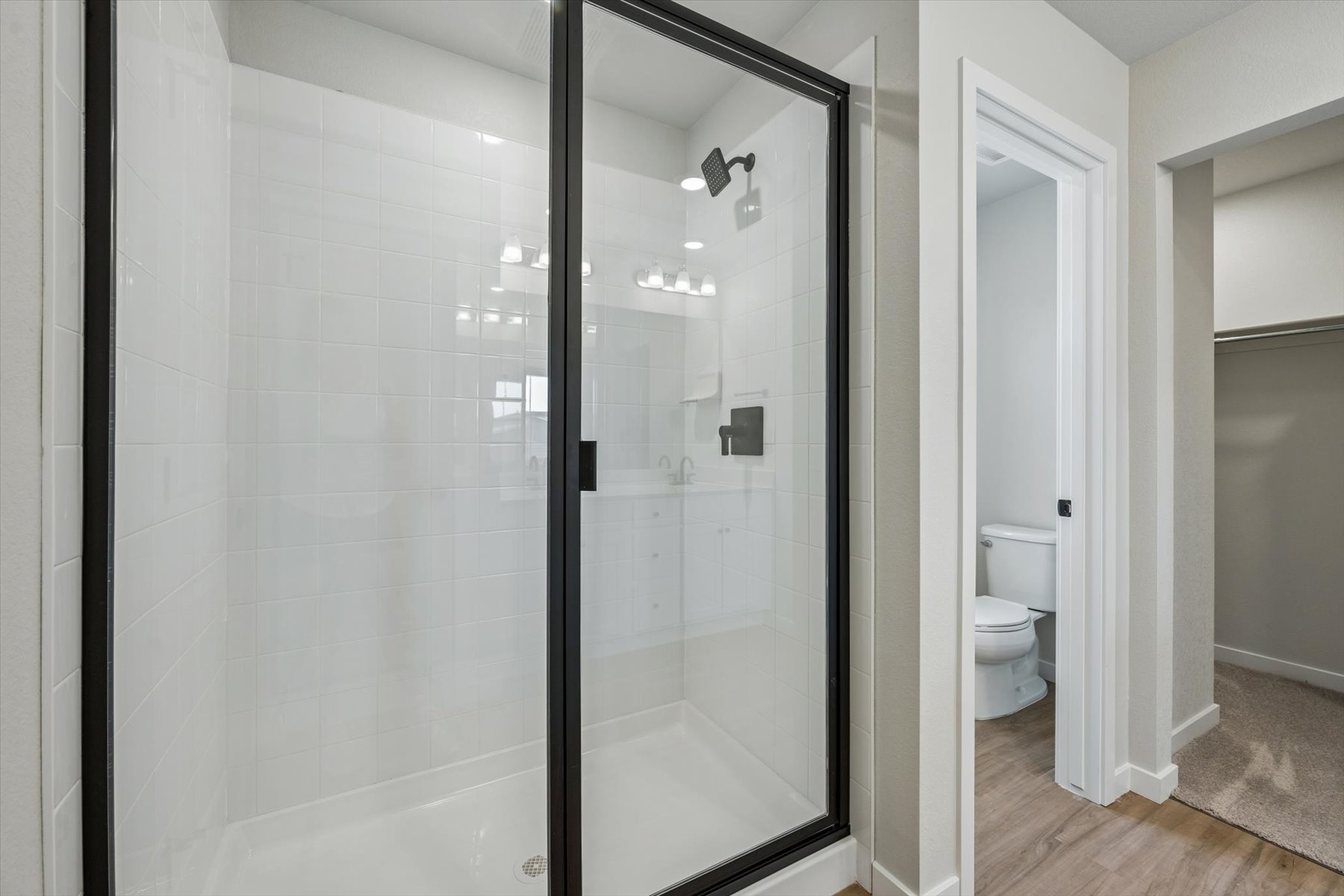A bathroom with a glass shower.