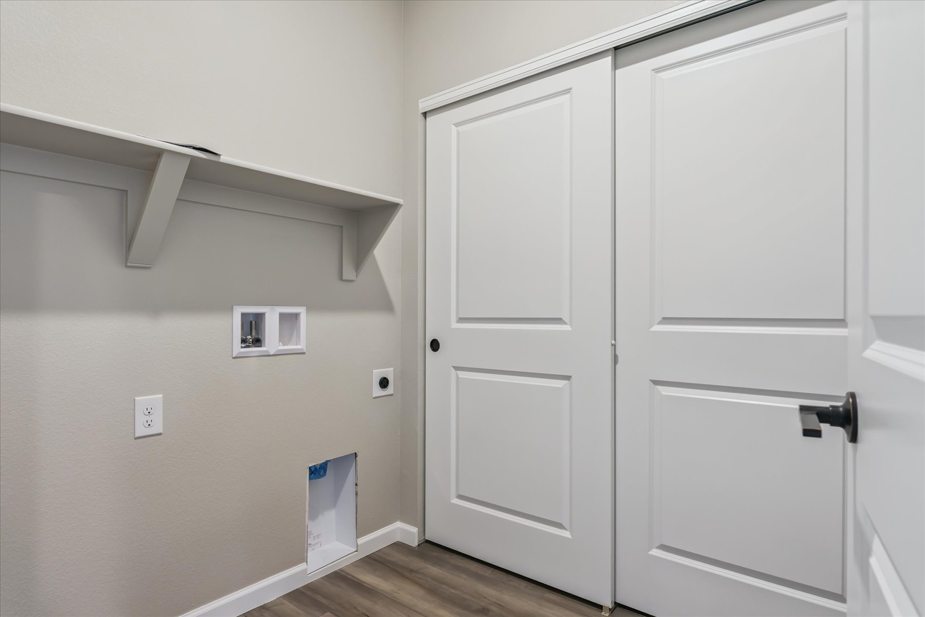 A white wall with white doors.