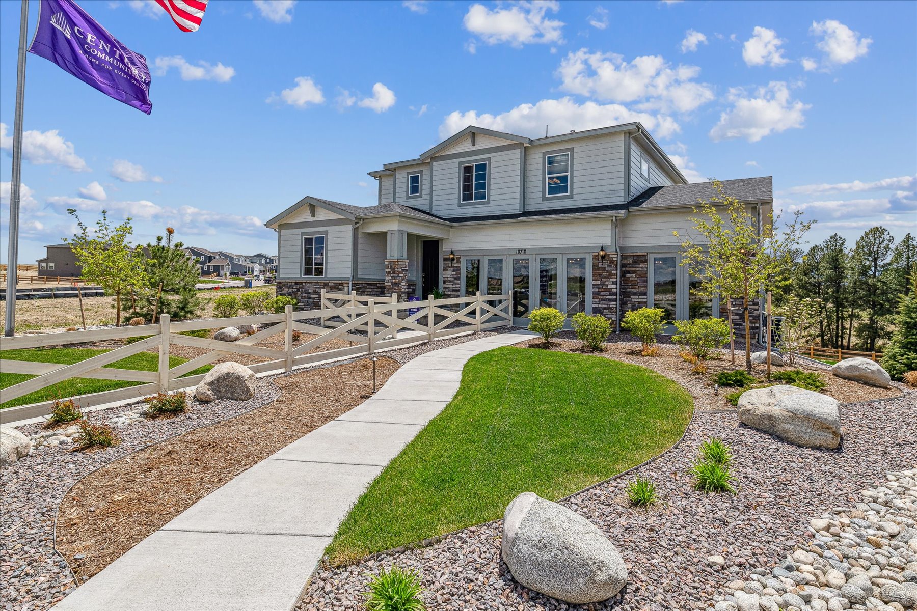A house with a stone driveway.