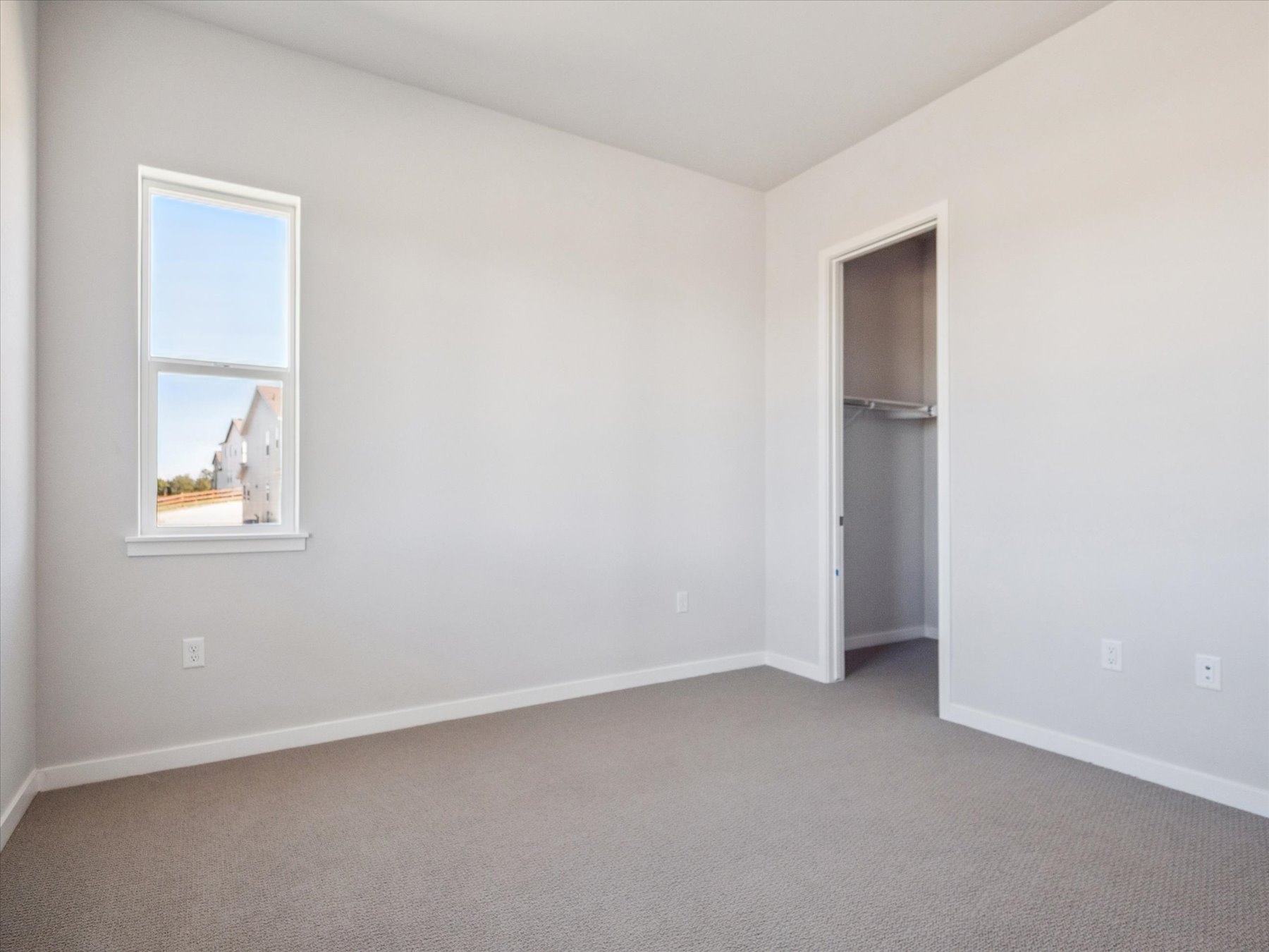 A room with a door and a window.