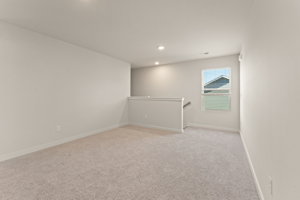 A room with a window and a door.