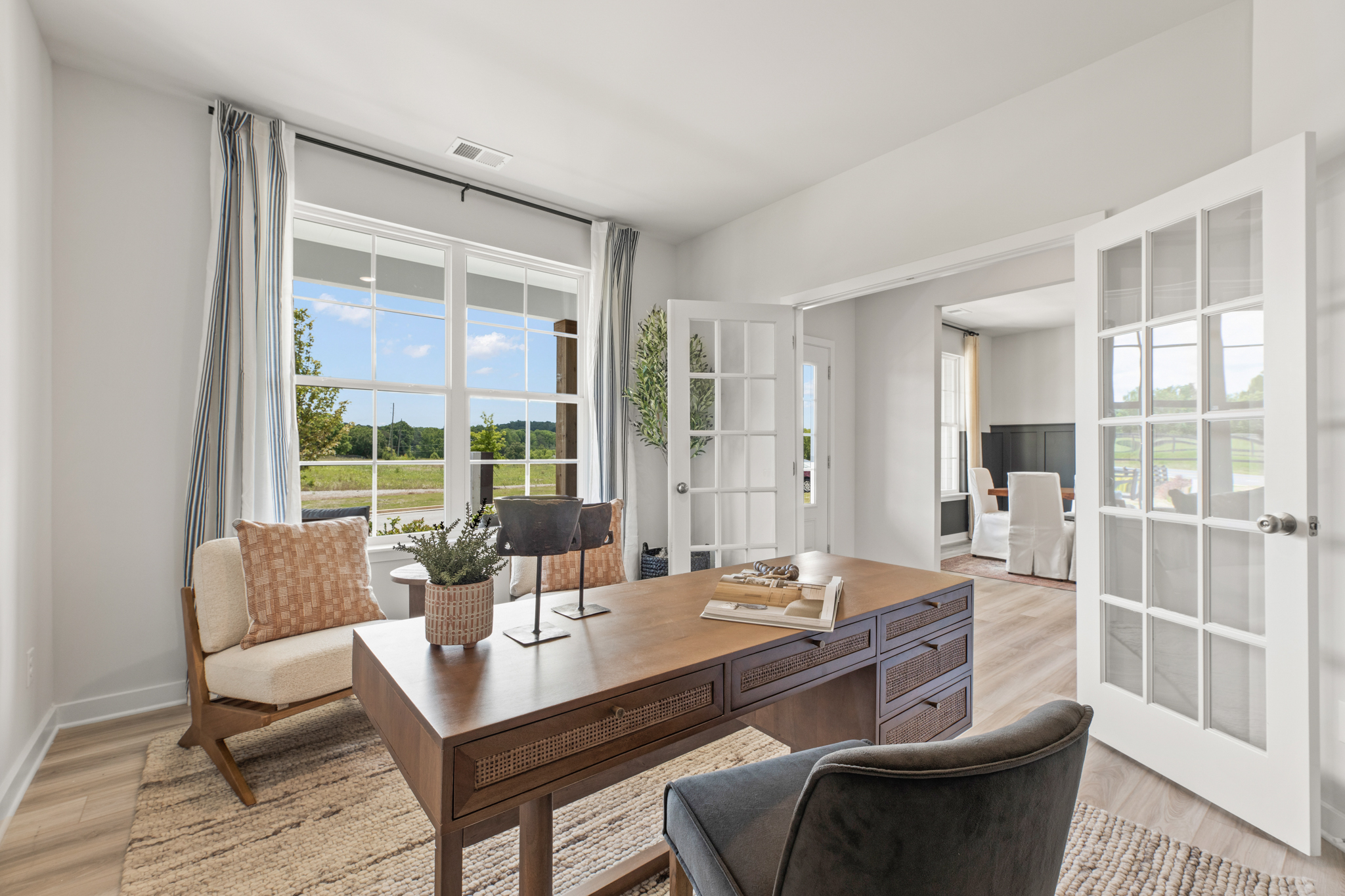 A large dining room with a large table and chairs.