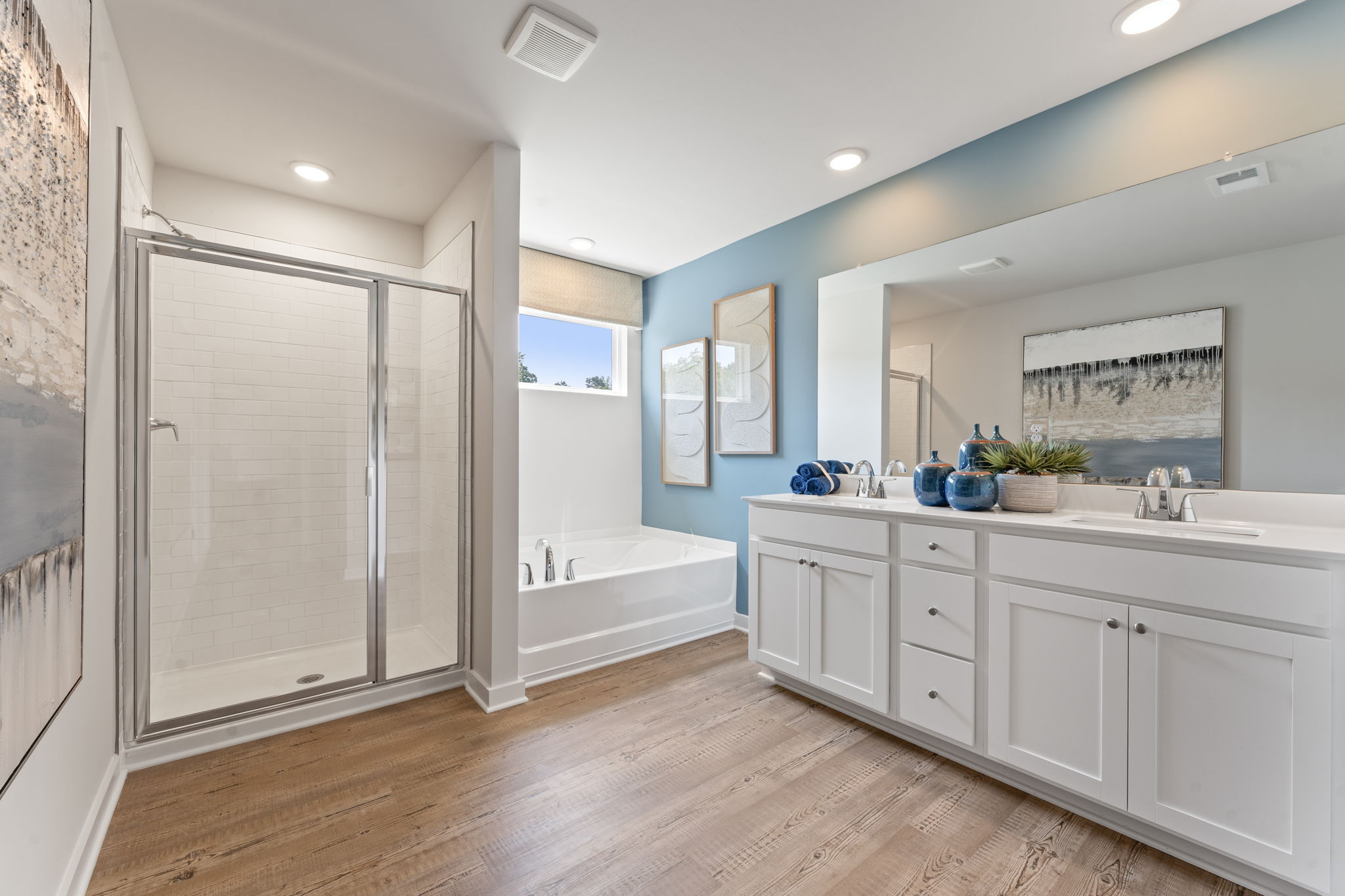 A bathroom with a tub and sink.