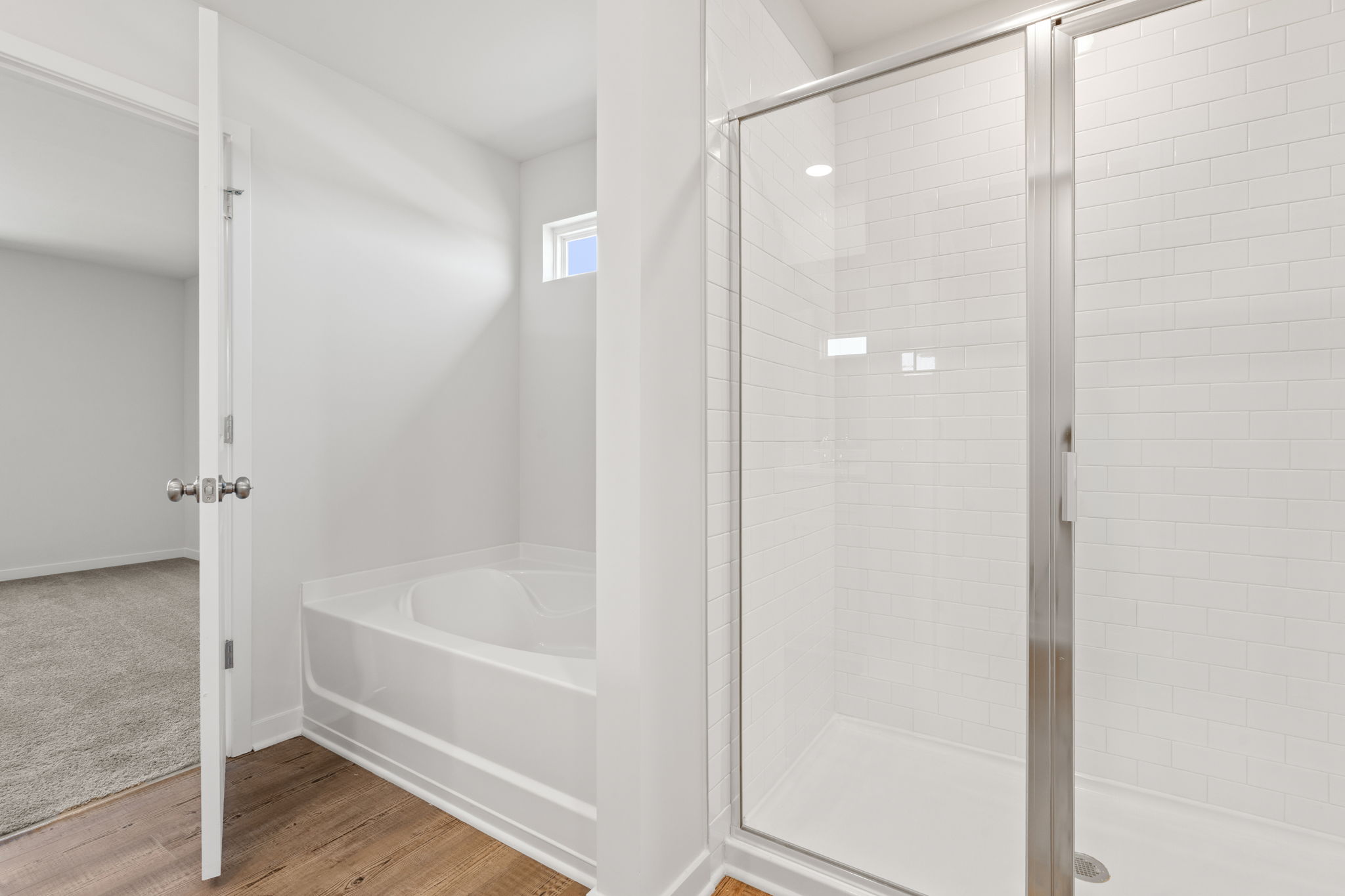 A bathroom with a glass shower.