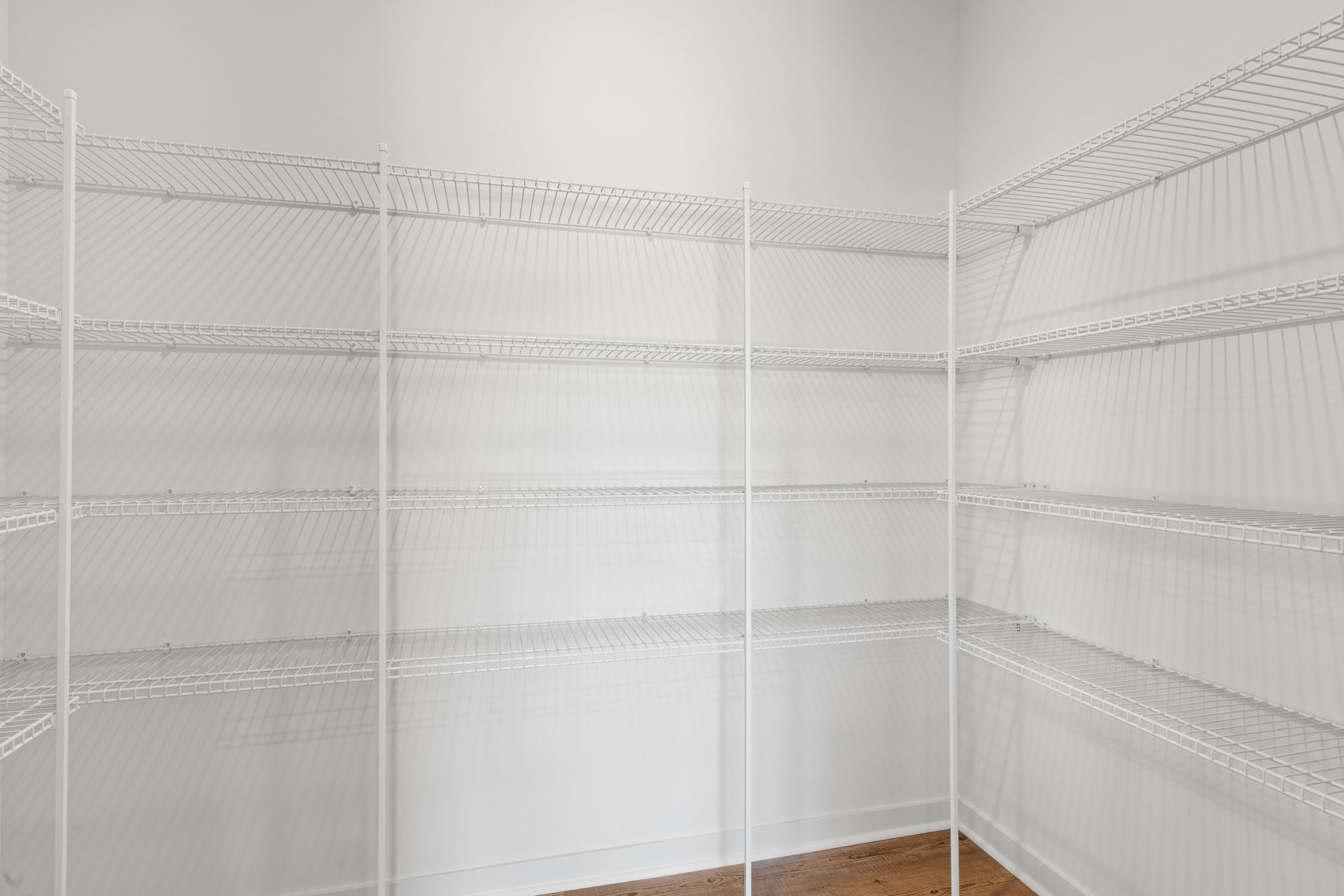 A white wall with a white frame.