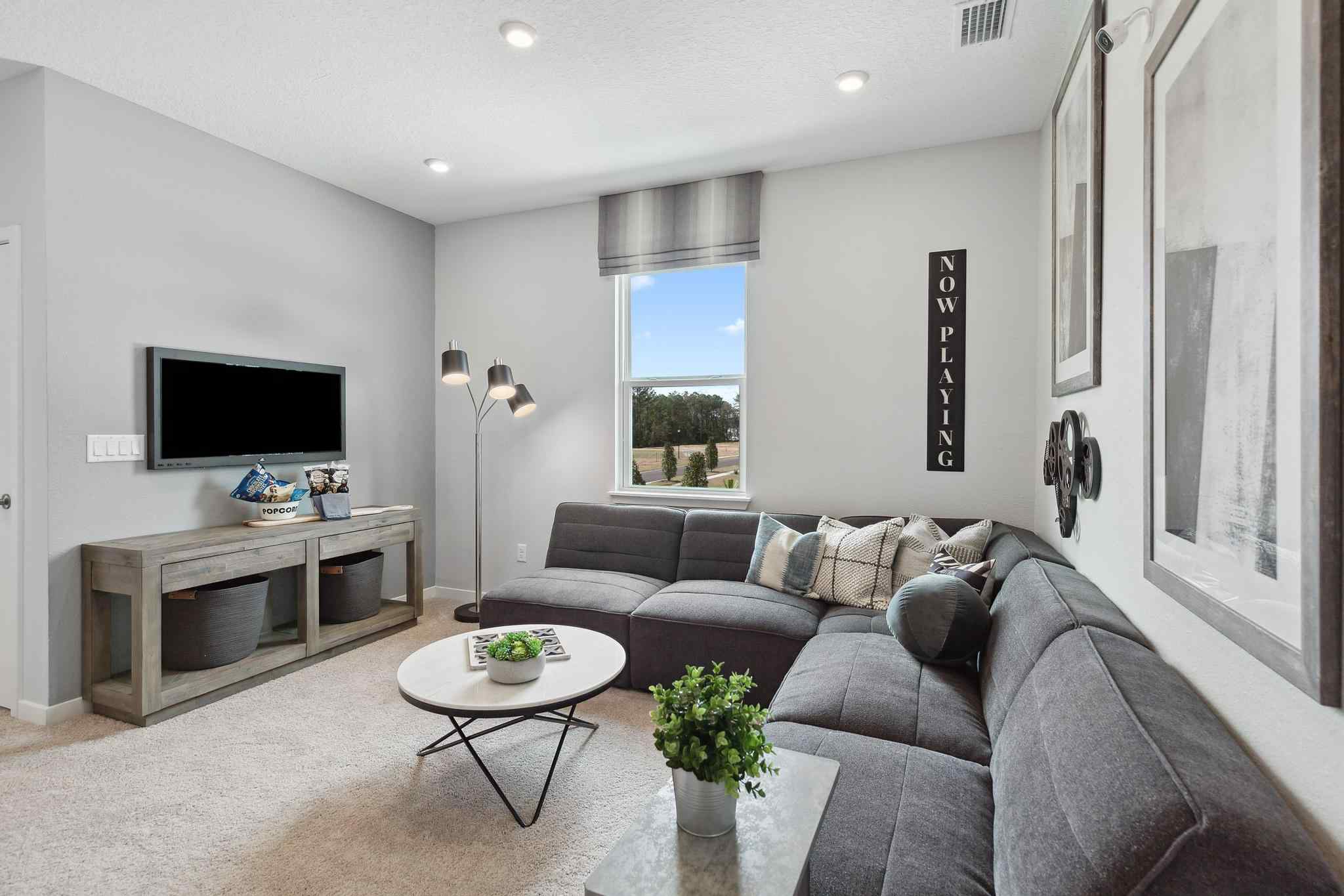 A living room with a couch and a coffee table.