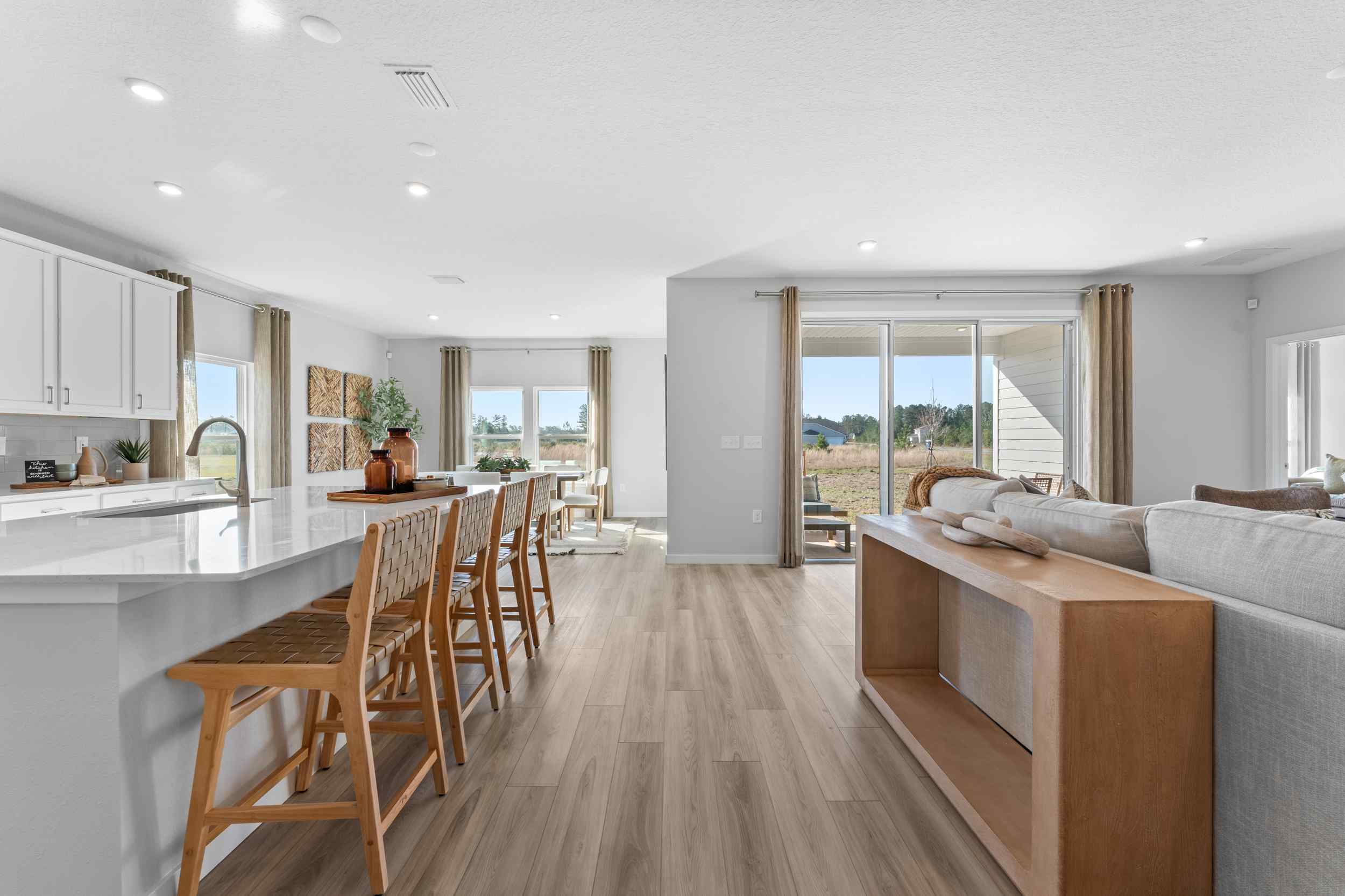 A large kitchen with a dining table.
