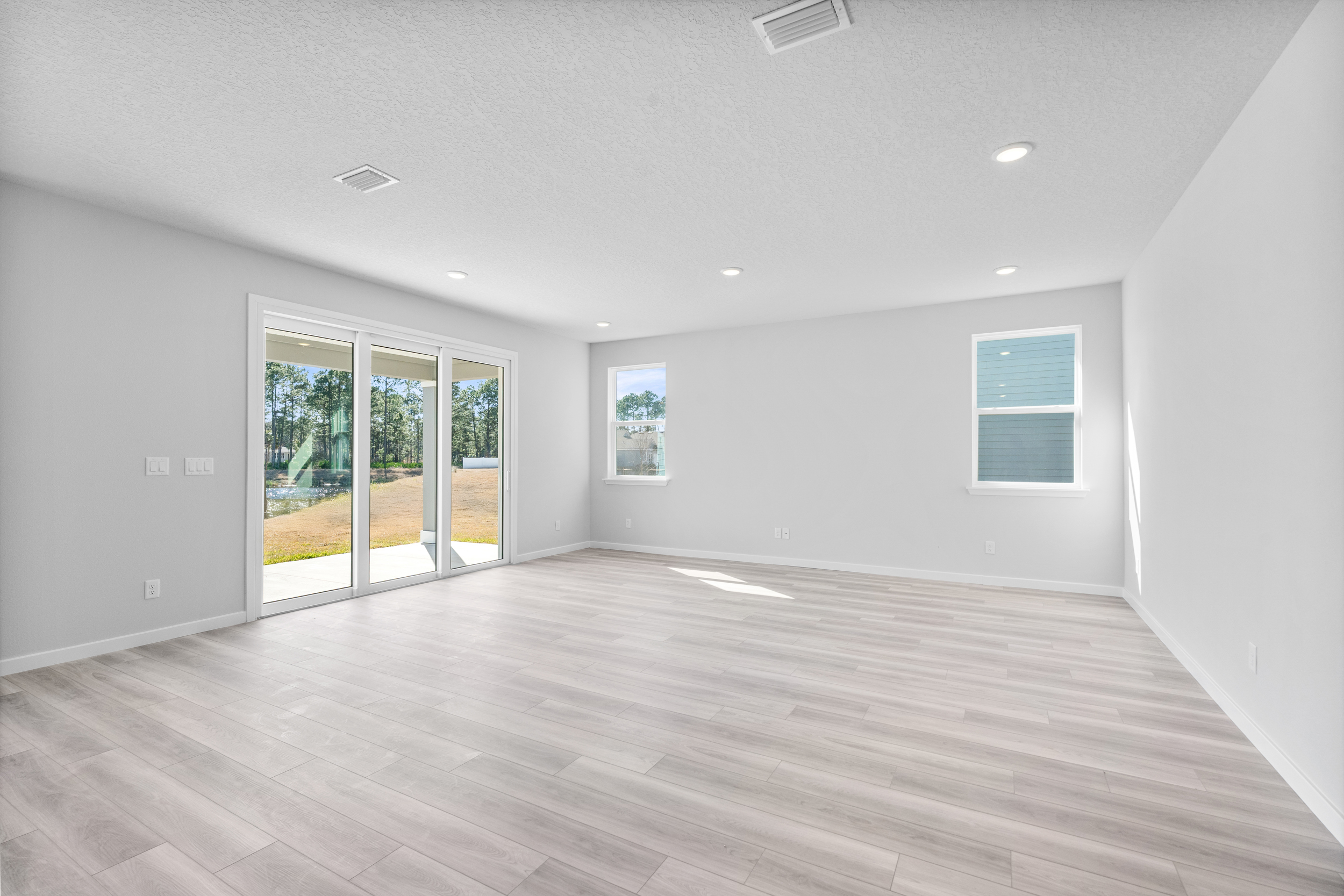 Lot 46 Living Area with Large Sliding Doors to Covered Patio at Reserve East