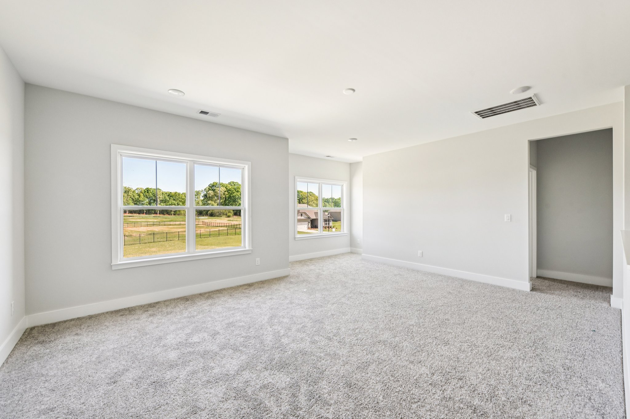 A room with a window and a door.