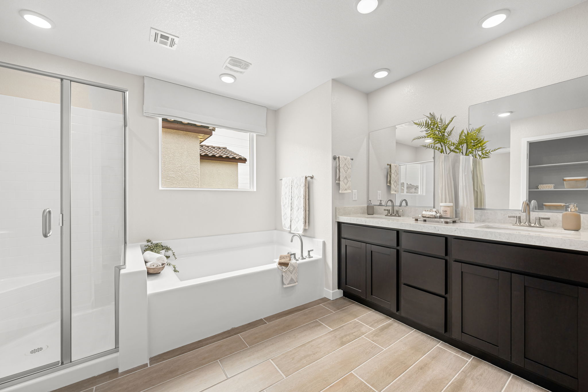 A bathroom with a tub and sink.
