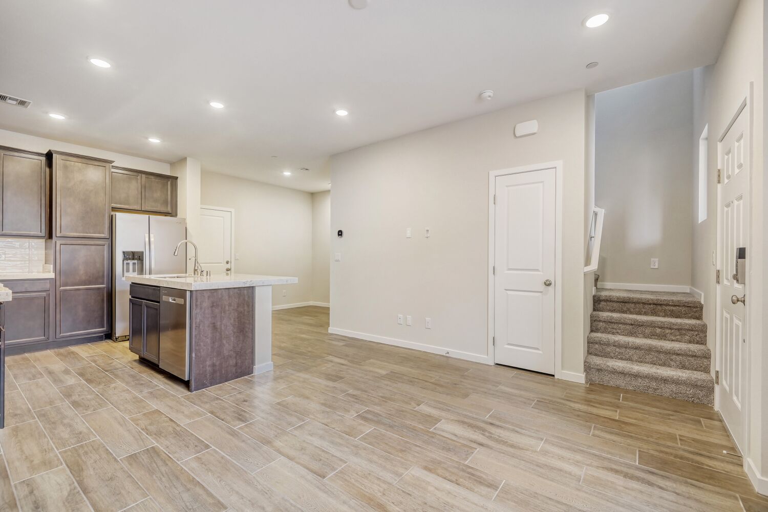 A kitchen with wooden floors.