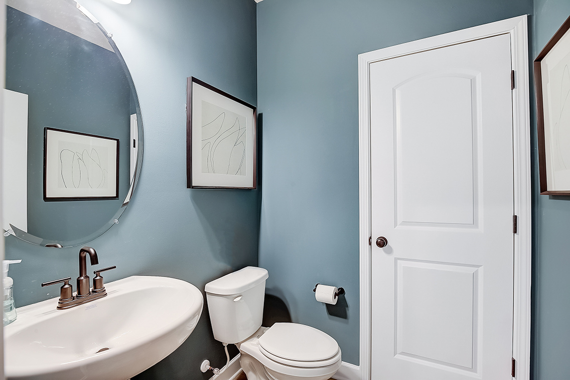 A bathroom with blue walls.