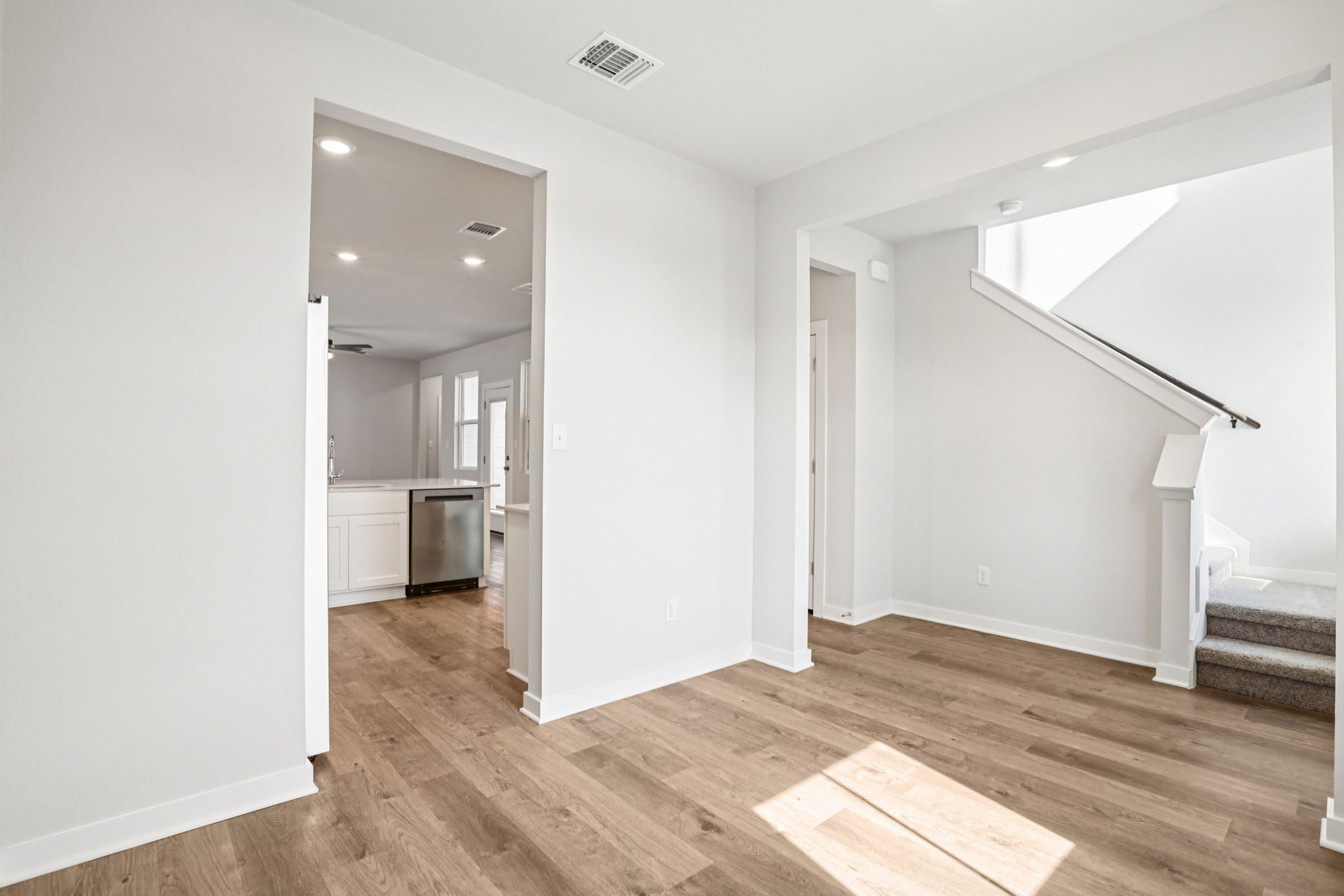 A room with a wood floor and a wood floor.