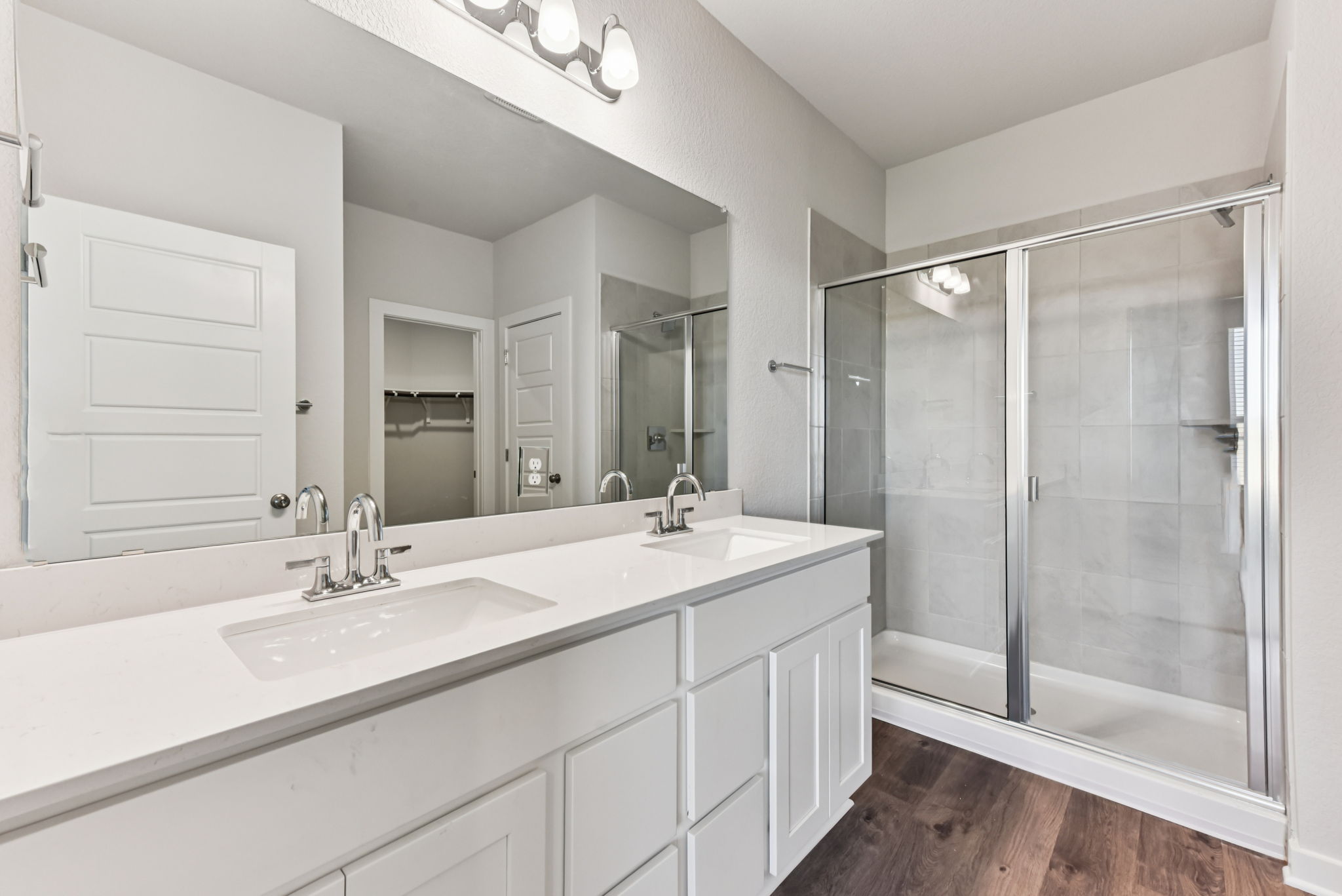 A bathroom with a glass shower.