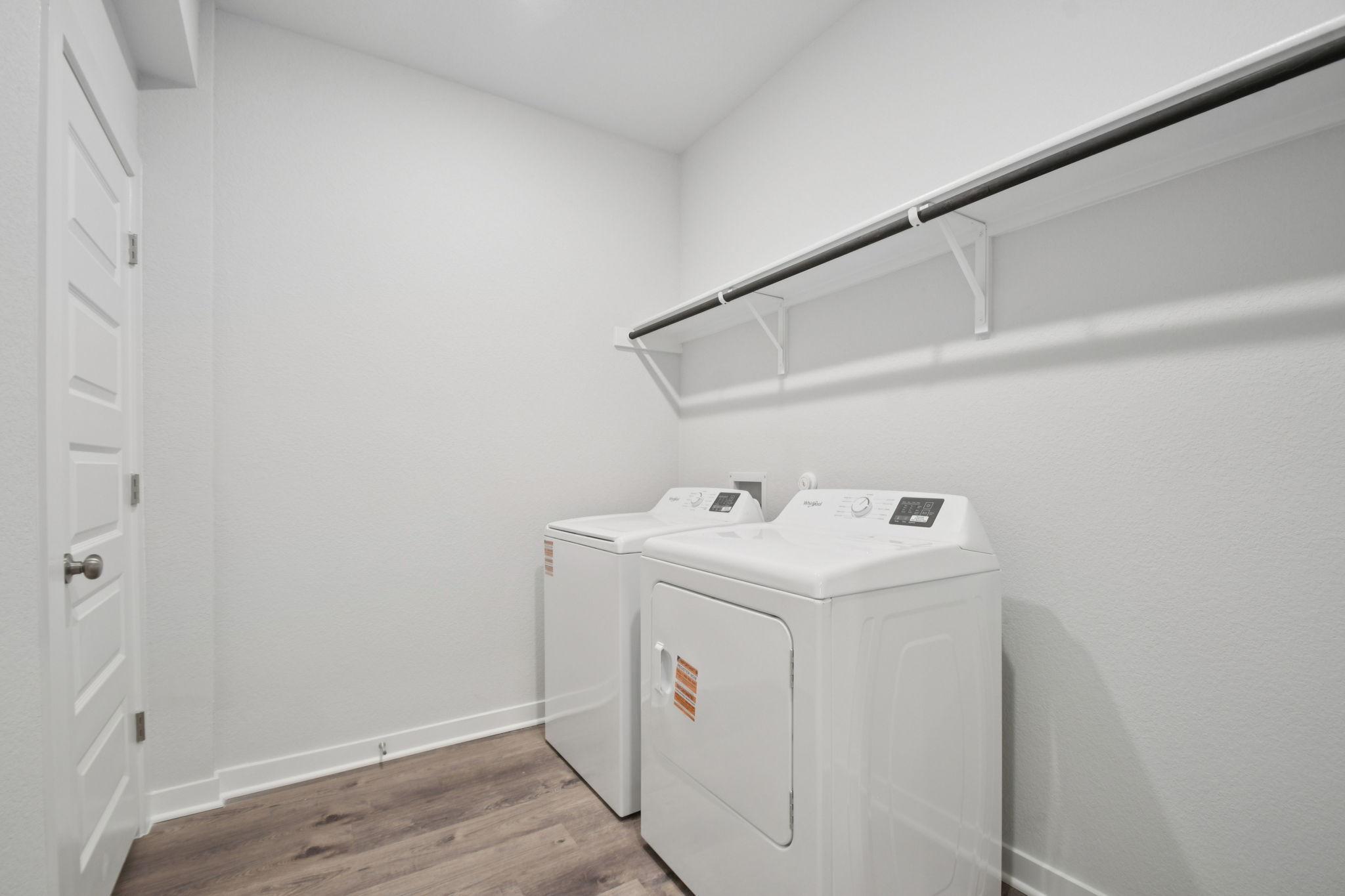 A white room with a white wall and a white cabinet.