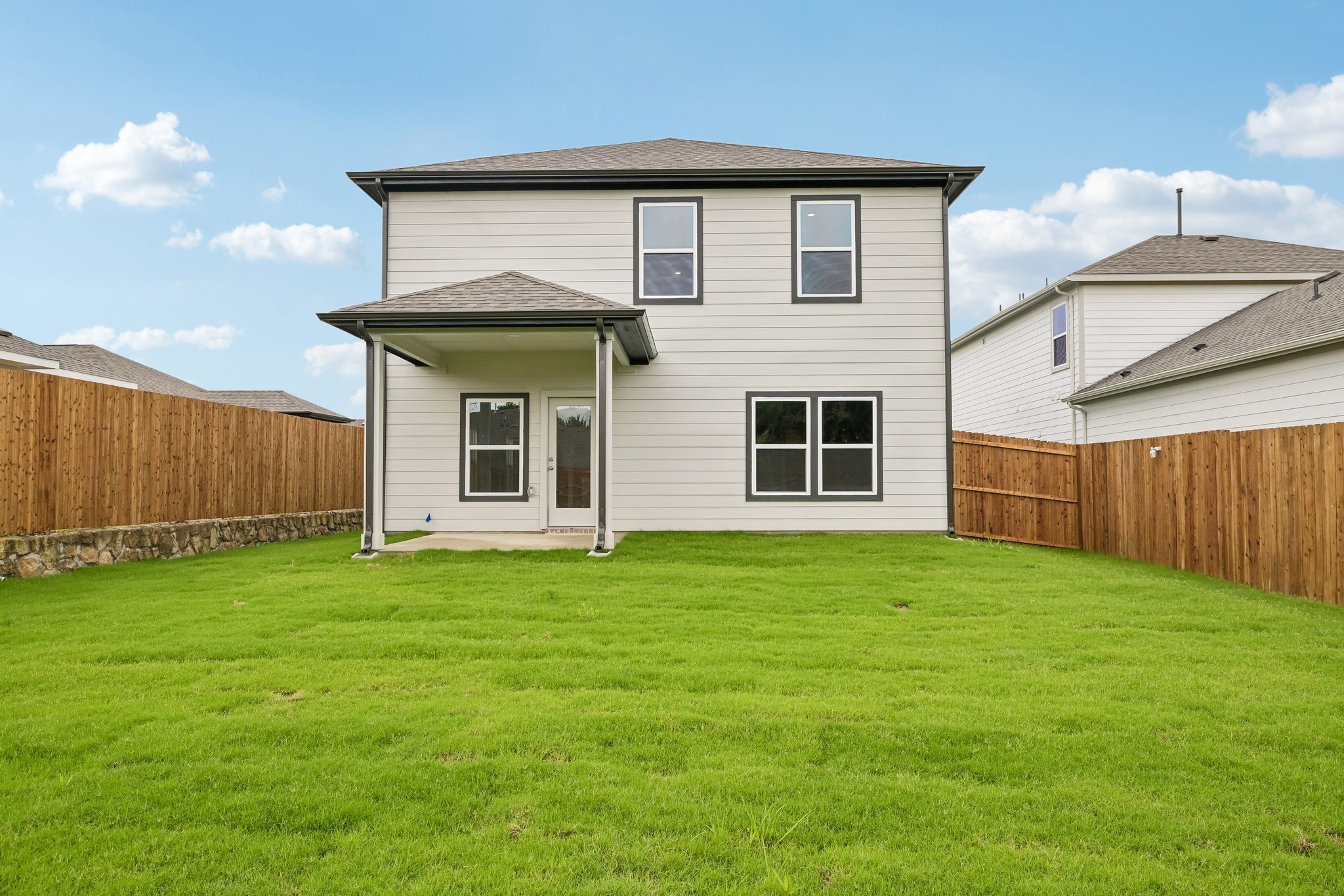A house with a grass yard.