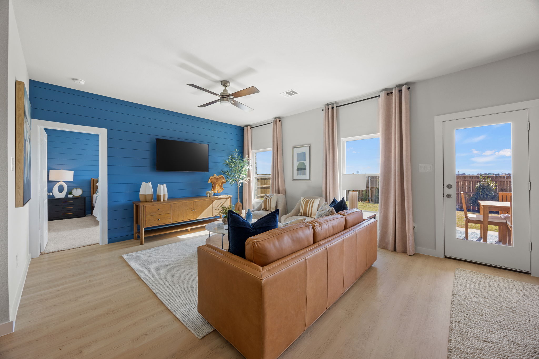 A living room with a large blue wall.