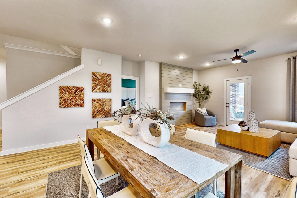 A living room with a dining table.