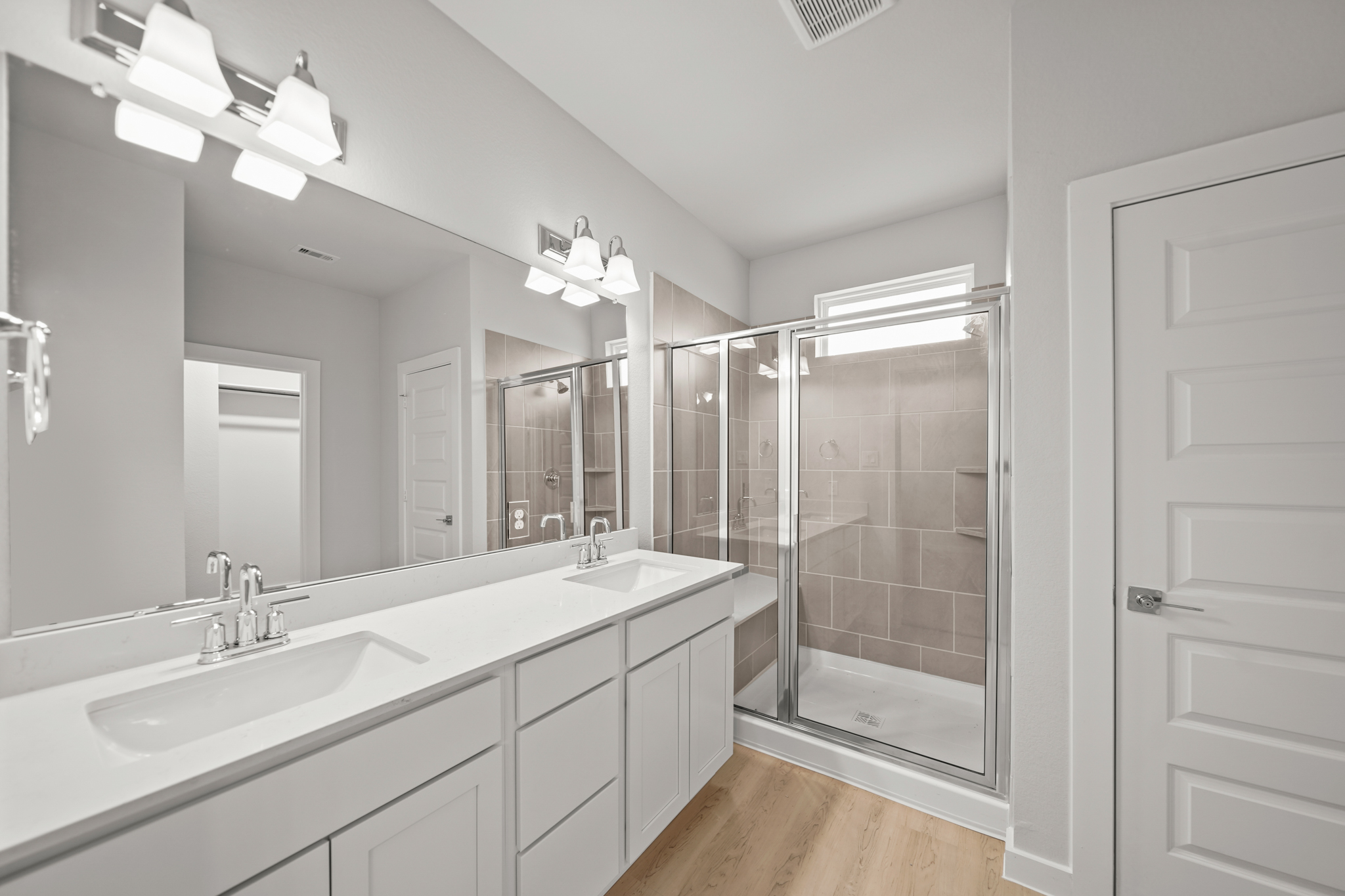 A bathroom with a glass shower.