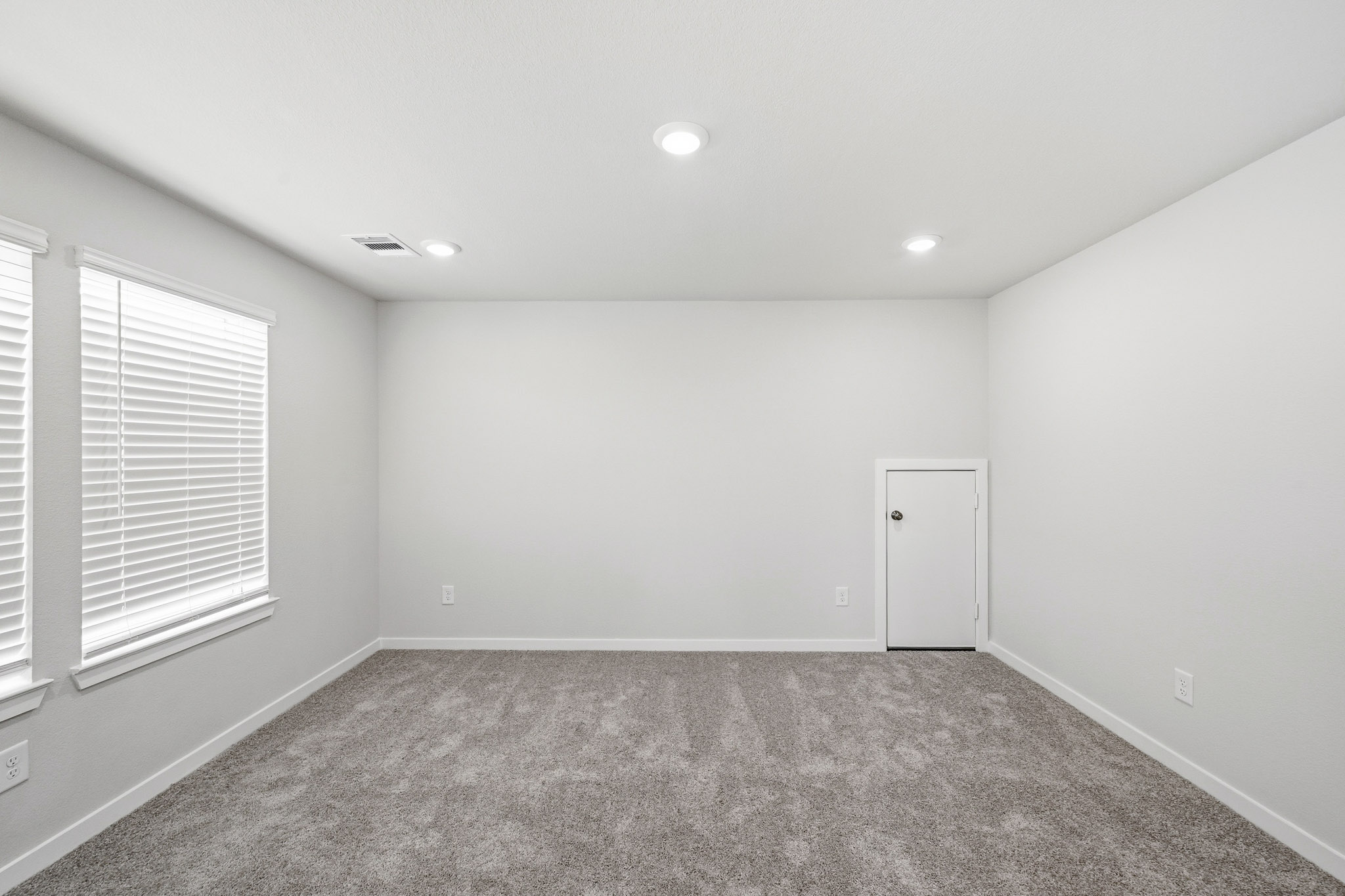 A room with a door and a window.